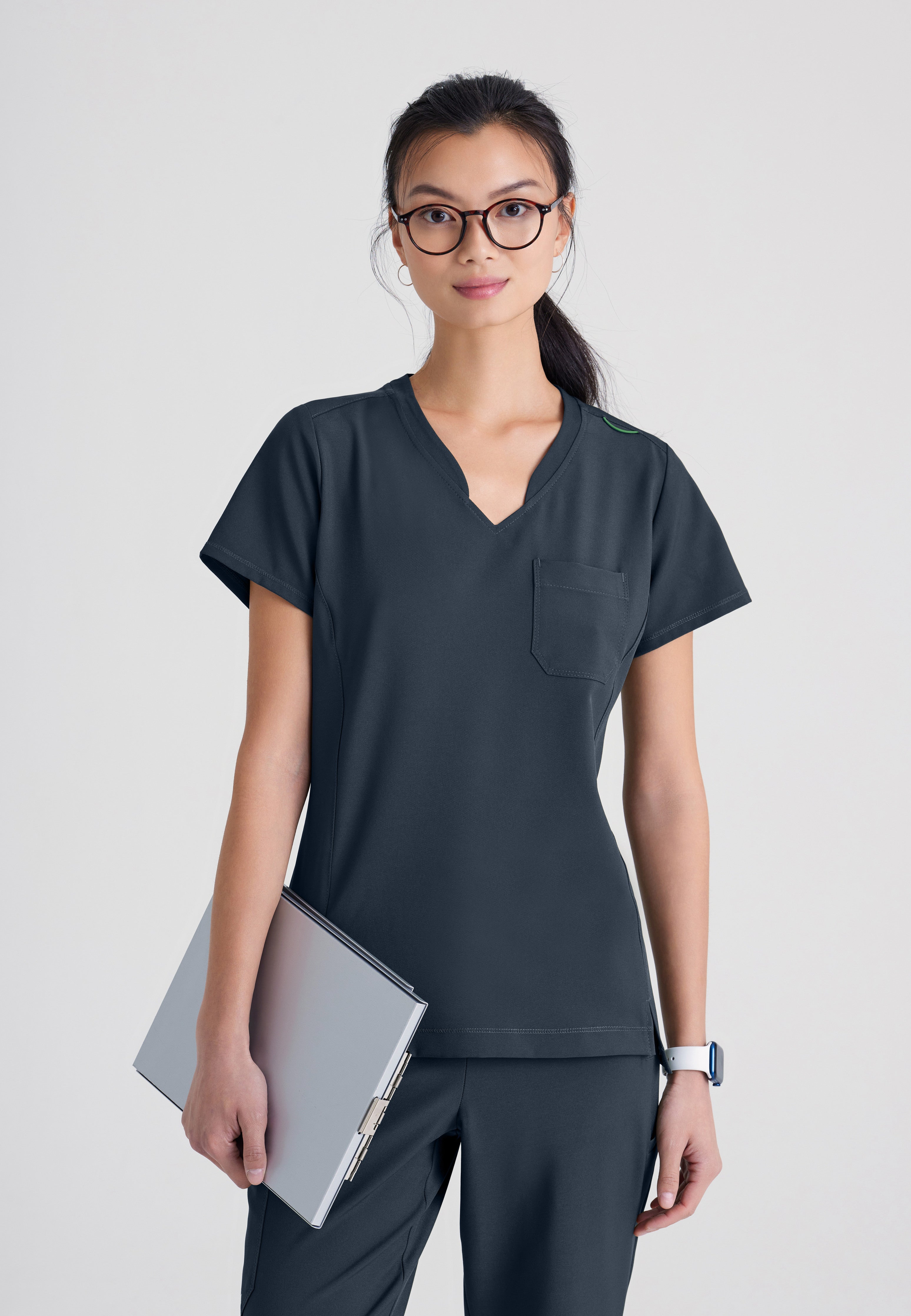 Front View of the Sway 1-Pocket Banded V-Neck Ciclo® Scrub Top in Black from Grey's Anatomy™ by Barco Evolve