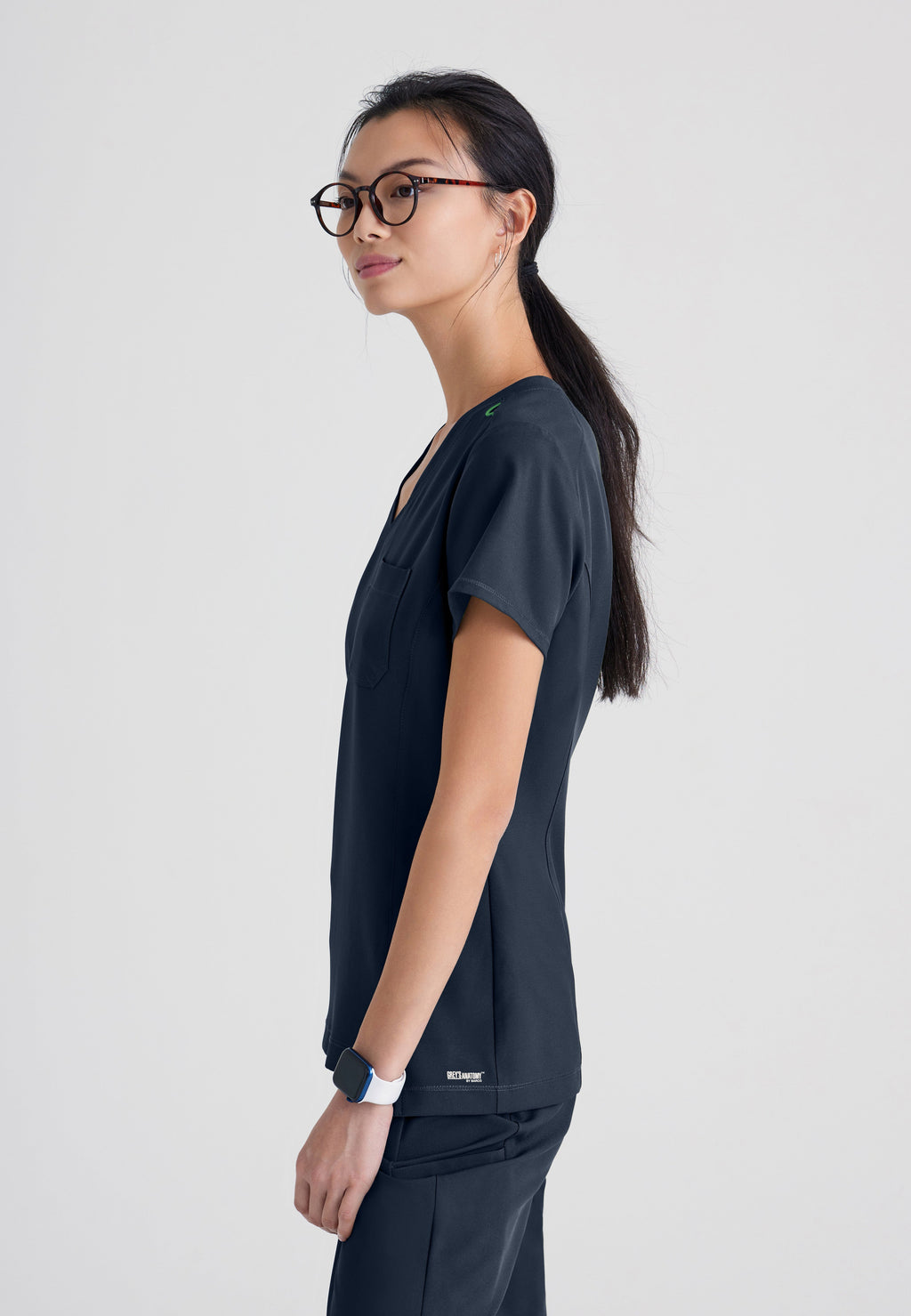Side View of the Sway 1-Pocket Banded V-Neck Ciclo® Scrub Top in Steel from Grey's Anatomy™ by Barco Evolve