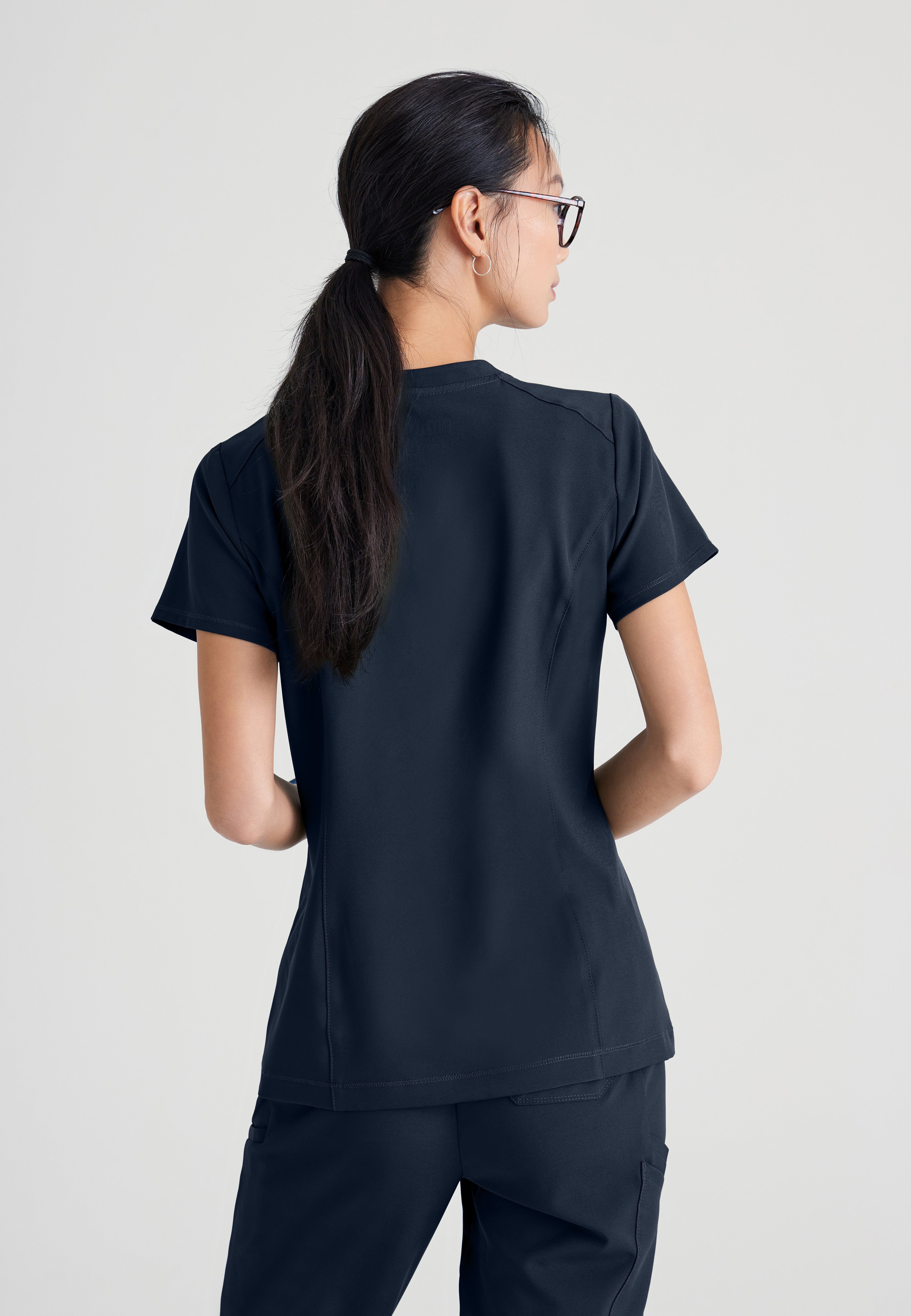 Back View of the Sway 1-Pocket Banded V-Neck Ciclo® Scrub Top in Steel from Grey's Anatomy™ by Barco Evolve