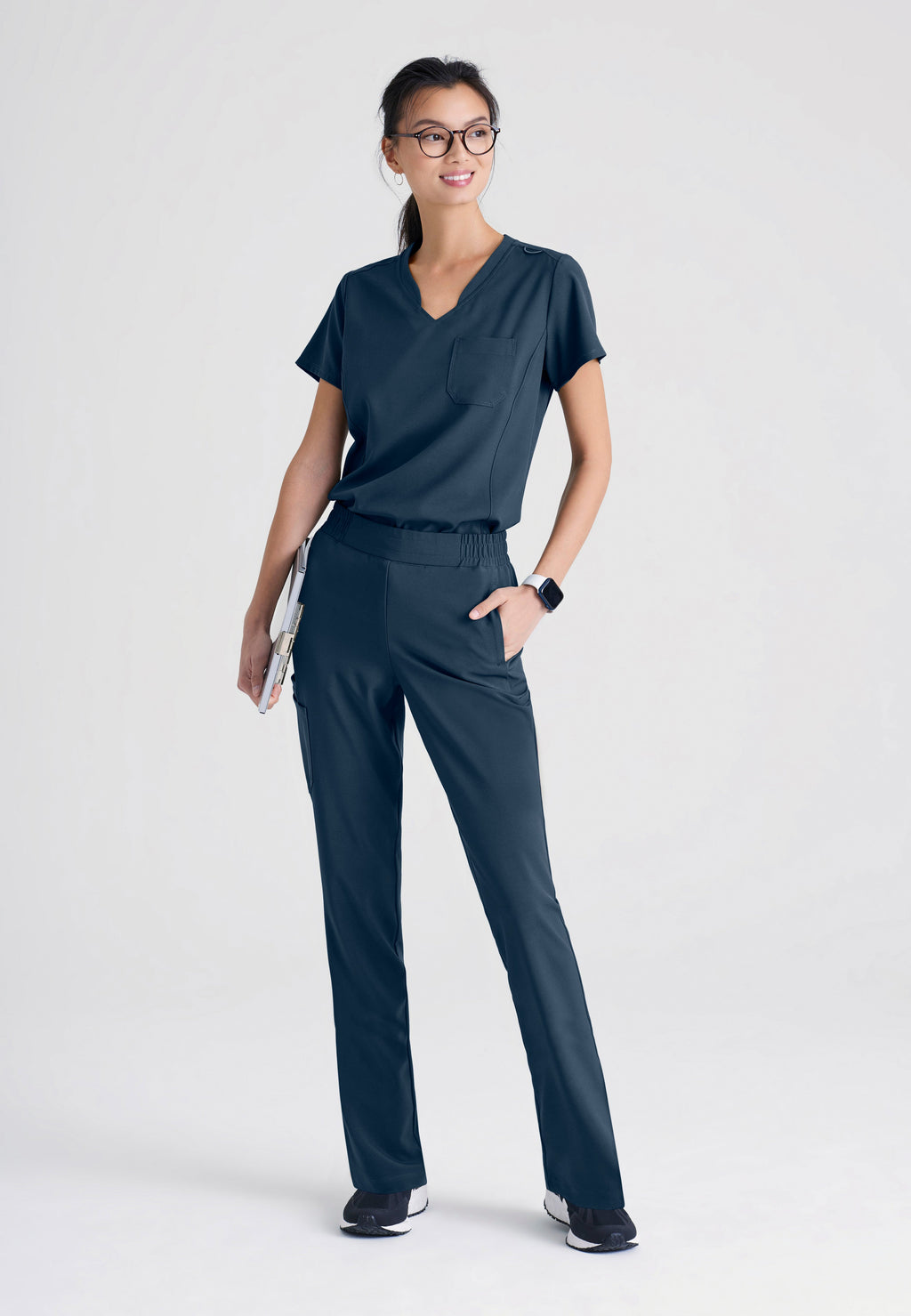 Full Body View of the Cosmo 6-Pocket Mid-Rise Tapered Leg Ciclo® Scrub Pant in Steel from Grey's Anatomy™ by Barco Evolve