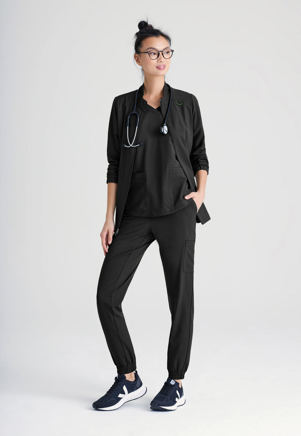 Full Body View of the Virtue 3-Pocket Stand-Up Collar Ciclo® Scrub Jacket in Black from Grey's Anatomy™ by Barco Evolve