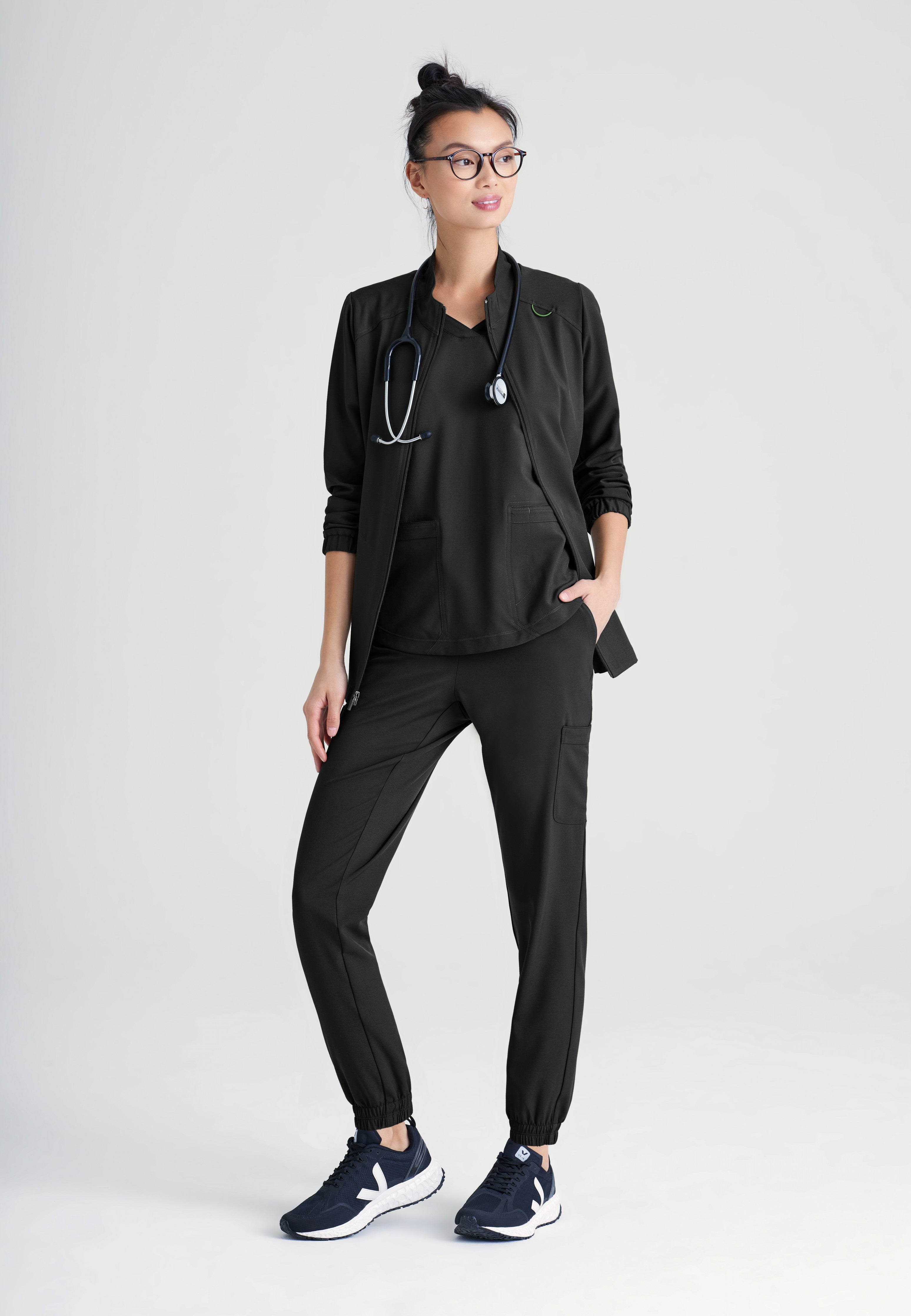 Full Body View of the Virtue 3-Pocket Stand-Up Collar Ciclo® Scrub Jacket in Black from Grey's Anatomy™ by Barco Evolve