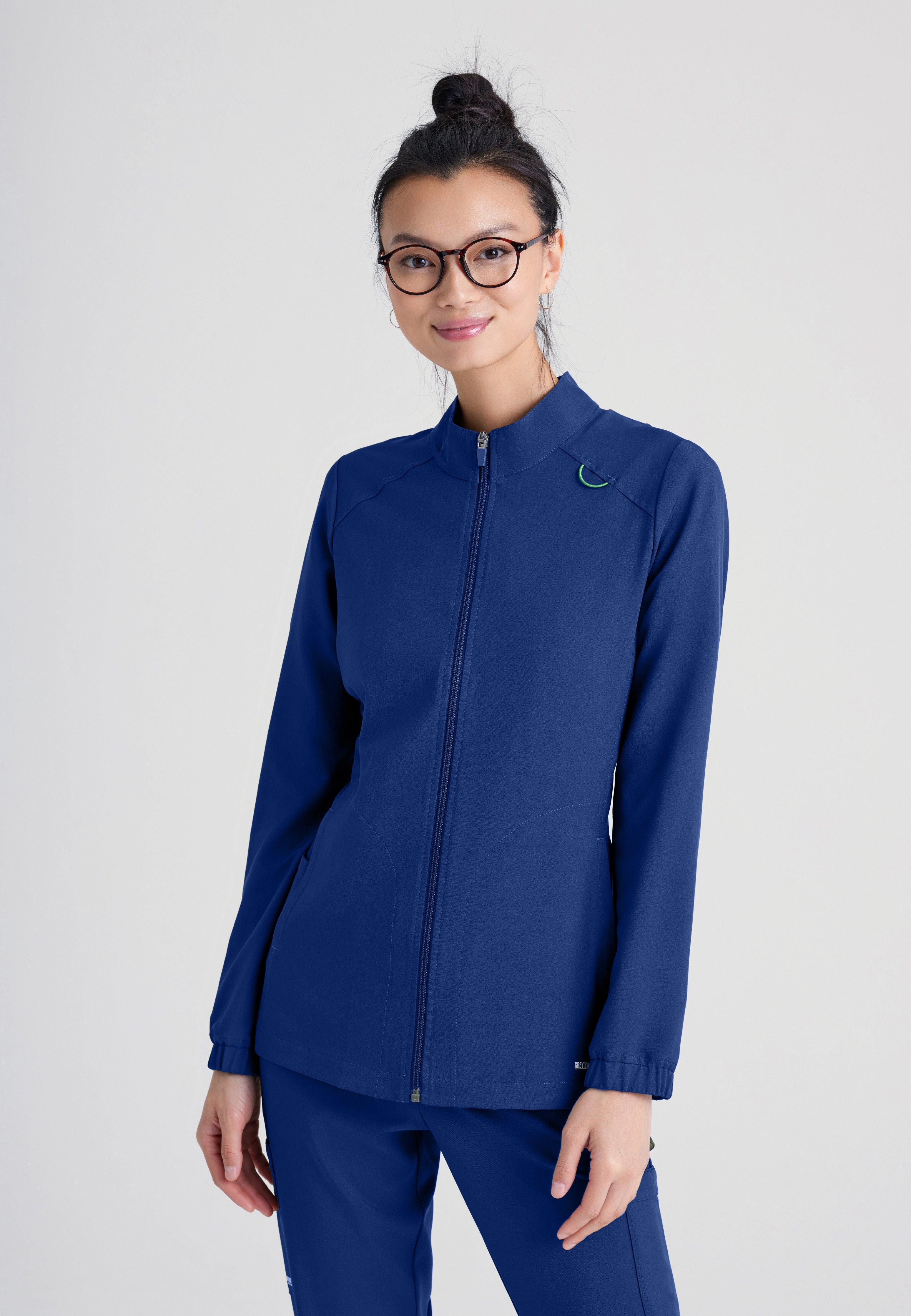 Front View of the Virtue 3-Pocket Stand-Up Collar Ciclo® Scrub Jacket in Indigo from Grey's Anatomy™ by Barco Evolve