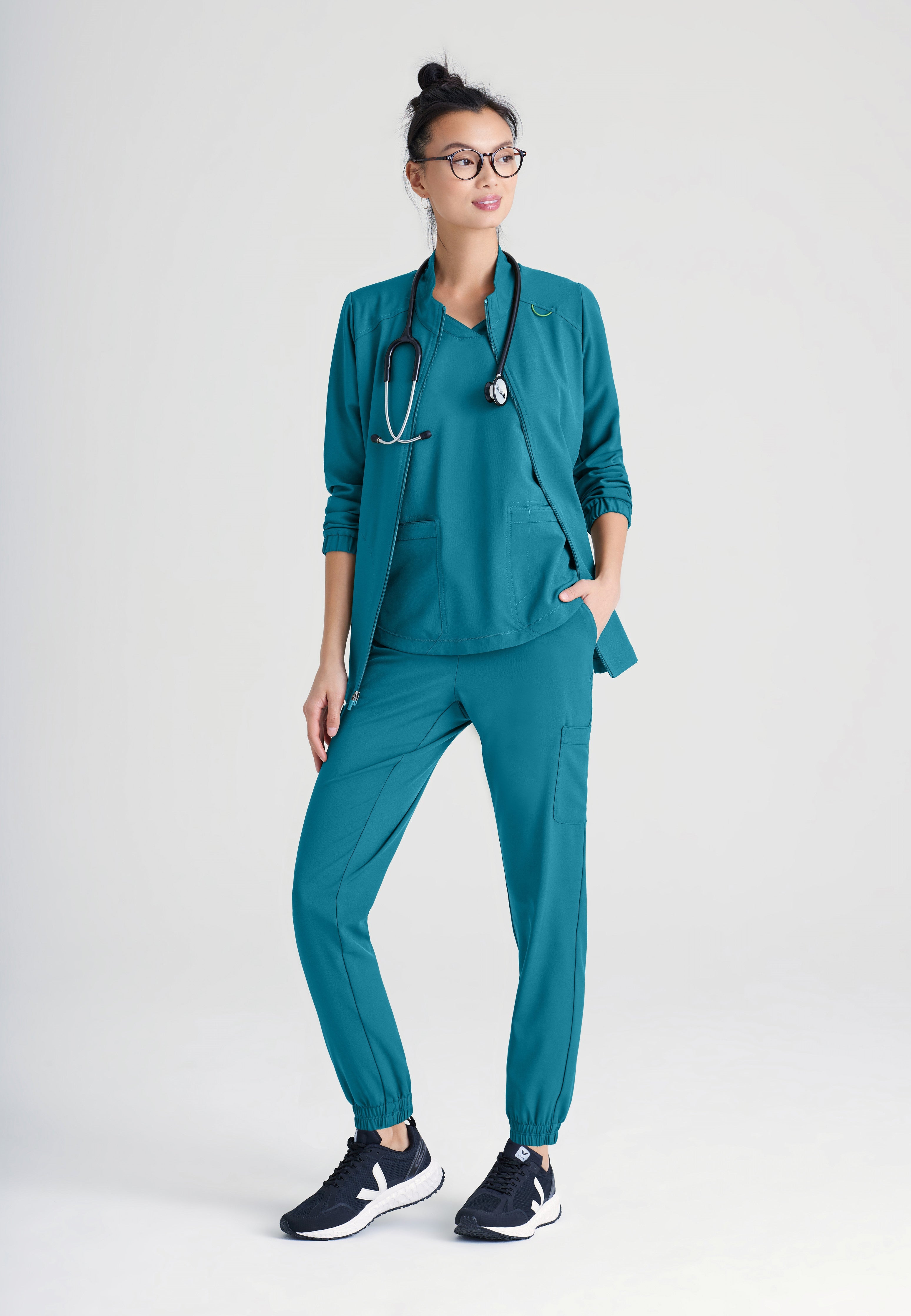 Full Body View of the Virtue 3-Pocket Stand-Up Collar Ciclo® Scrub Jacket in Bahama from Grey's Anatomy™ by Barco Evolve