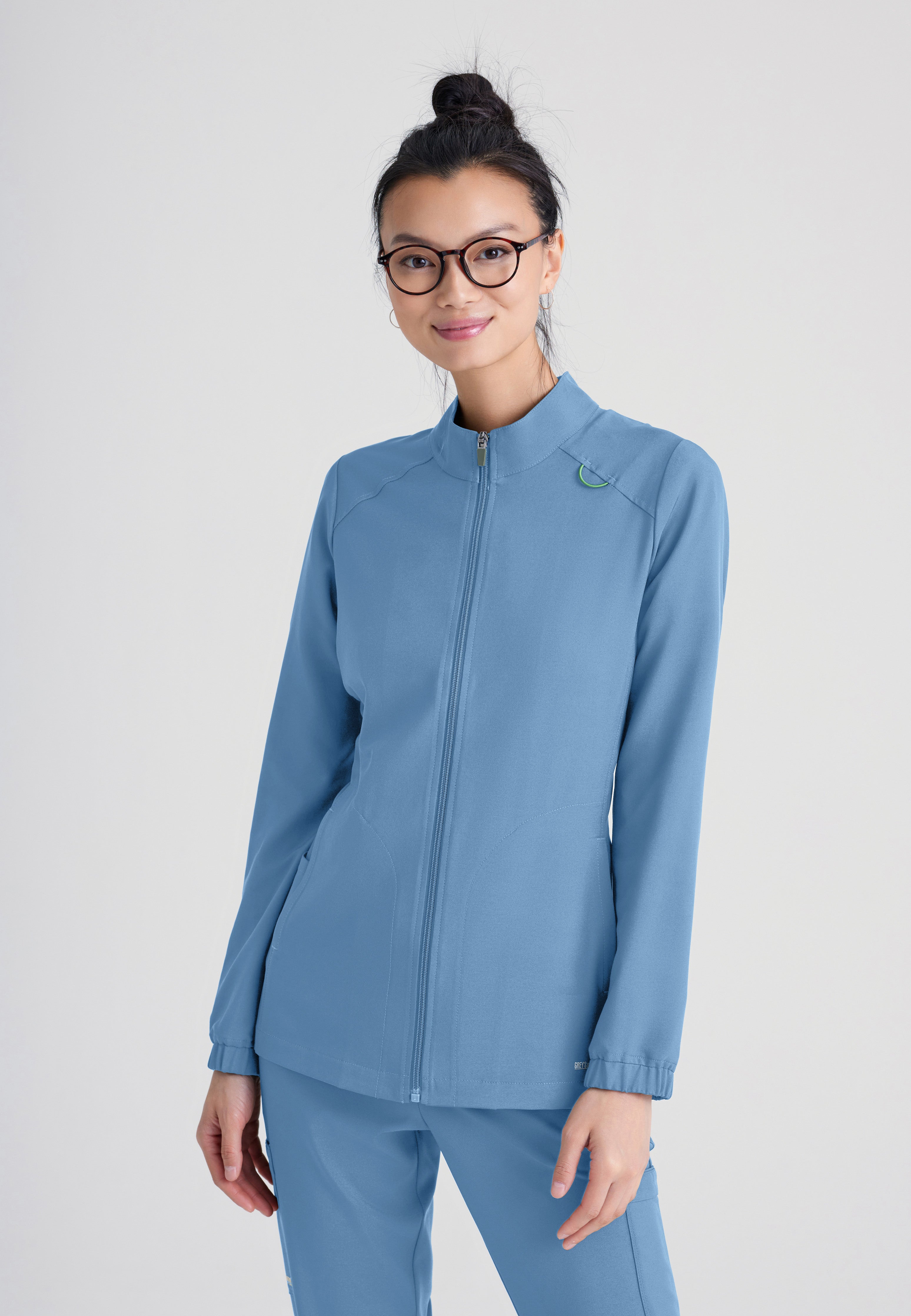 Front View of the Virtue 3-Pocket Stand-Up Collar Ciclo® Scrub Jacket in Ciel Blue from Grey's Anatomy™ by Barco Evolve
