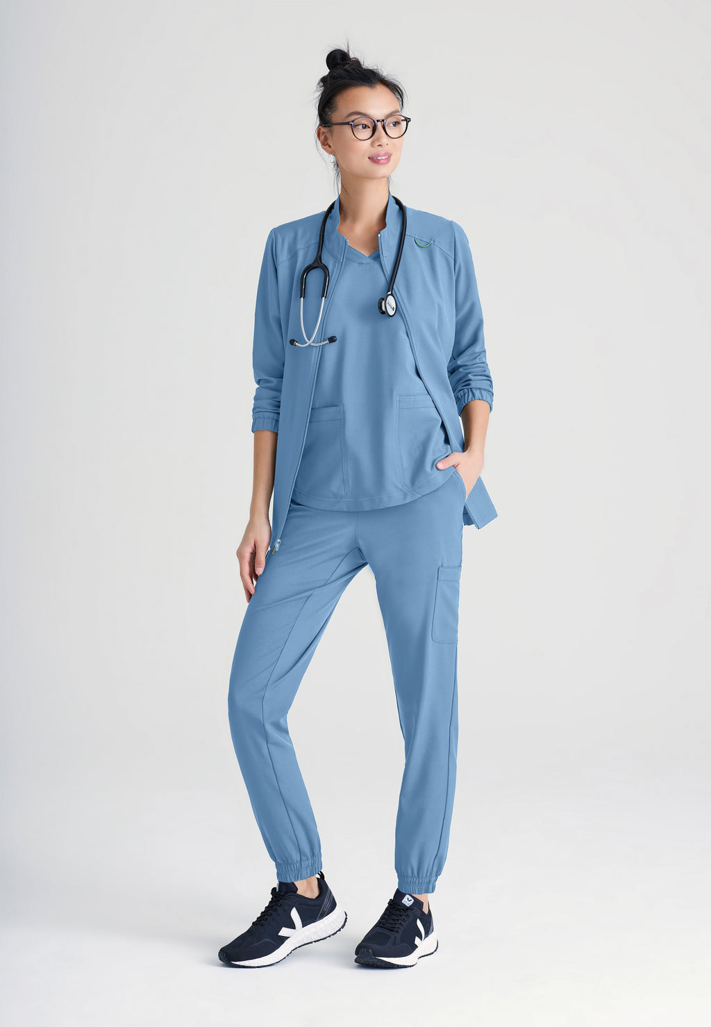 Full Body View of the Virtue 3-Pocket Stand-Up Collar Ciclo® Scrub Jacket in Ciel Blue from Grey's Anatomy™ by Barco Evolve