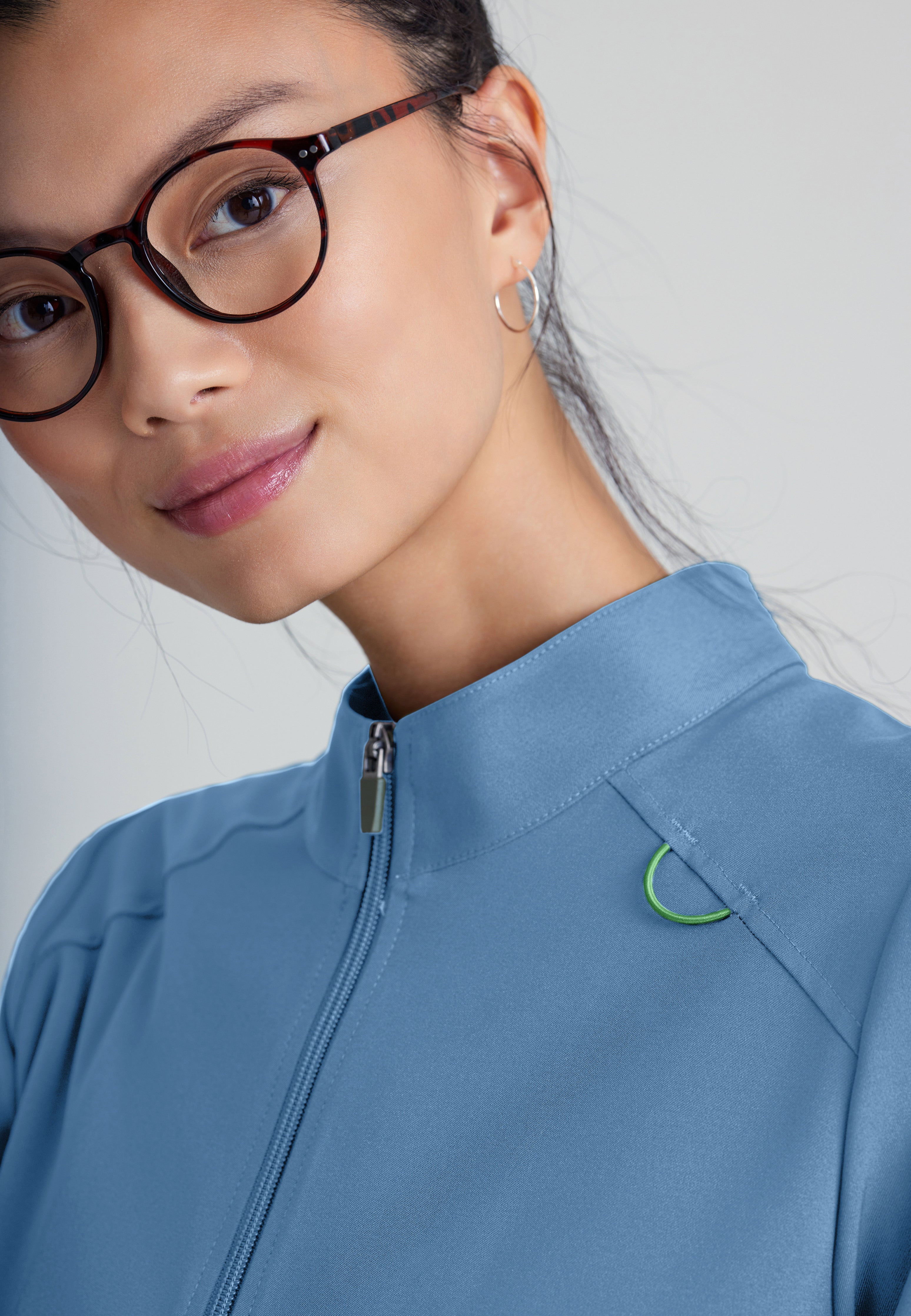Detail Shot of the Virtue 3-Pocket Stand-Up Collar Ciclo® Scrub Jacket in Ciel Blue from Grey's Anatomy™ by Barco Evolve