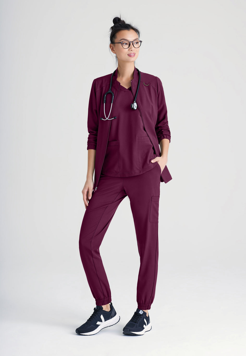 Full Body View of the Virtue 3-Pocket Stand-Up Collar Ciclo® Scrub Jacket in Wine from Grey's Anatomy™ by Barco Evolve