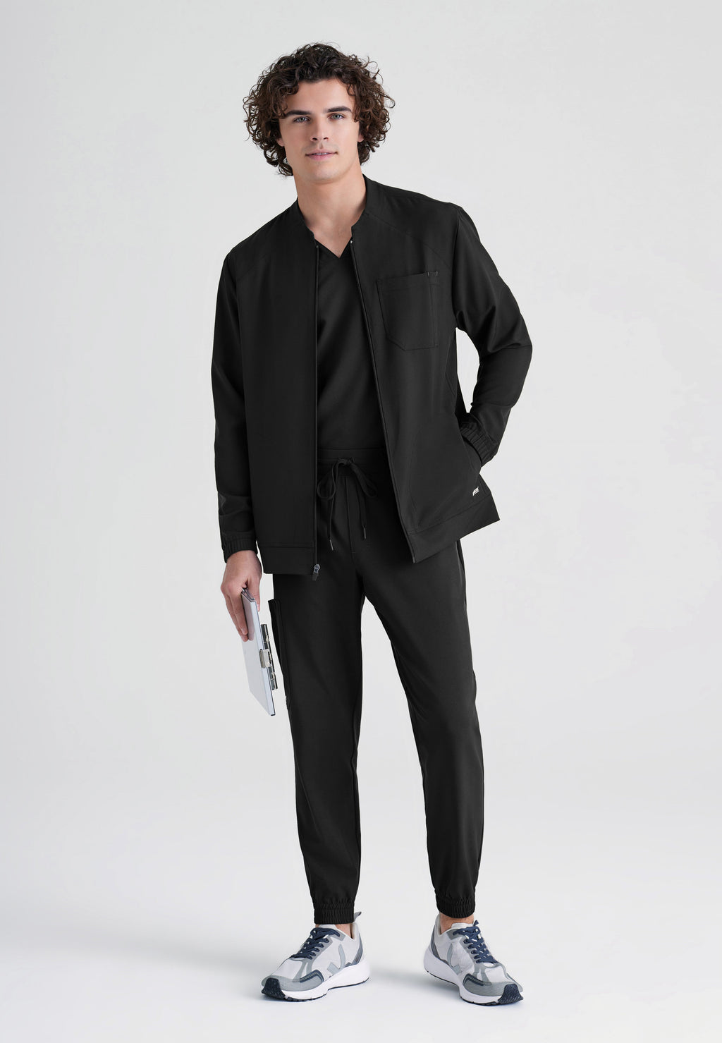 Full Body View of the Cycle 3-Pocket Crewneck Ciclo® Scrub Jacket in Black from Grey's Anatomy™ by Barco Evolve