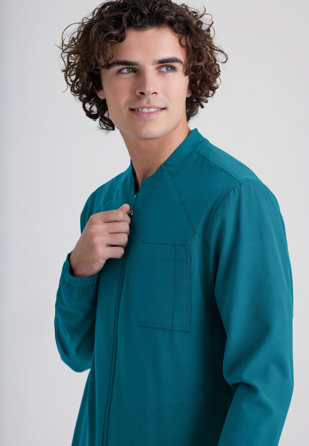 Detail Shot of the Cycle 3-Pocket Crewneck Ciclo® Scrub Jacket in Bahama from Grey's Anatomy™ by Barco Evolve