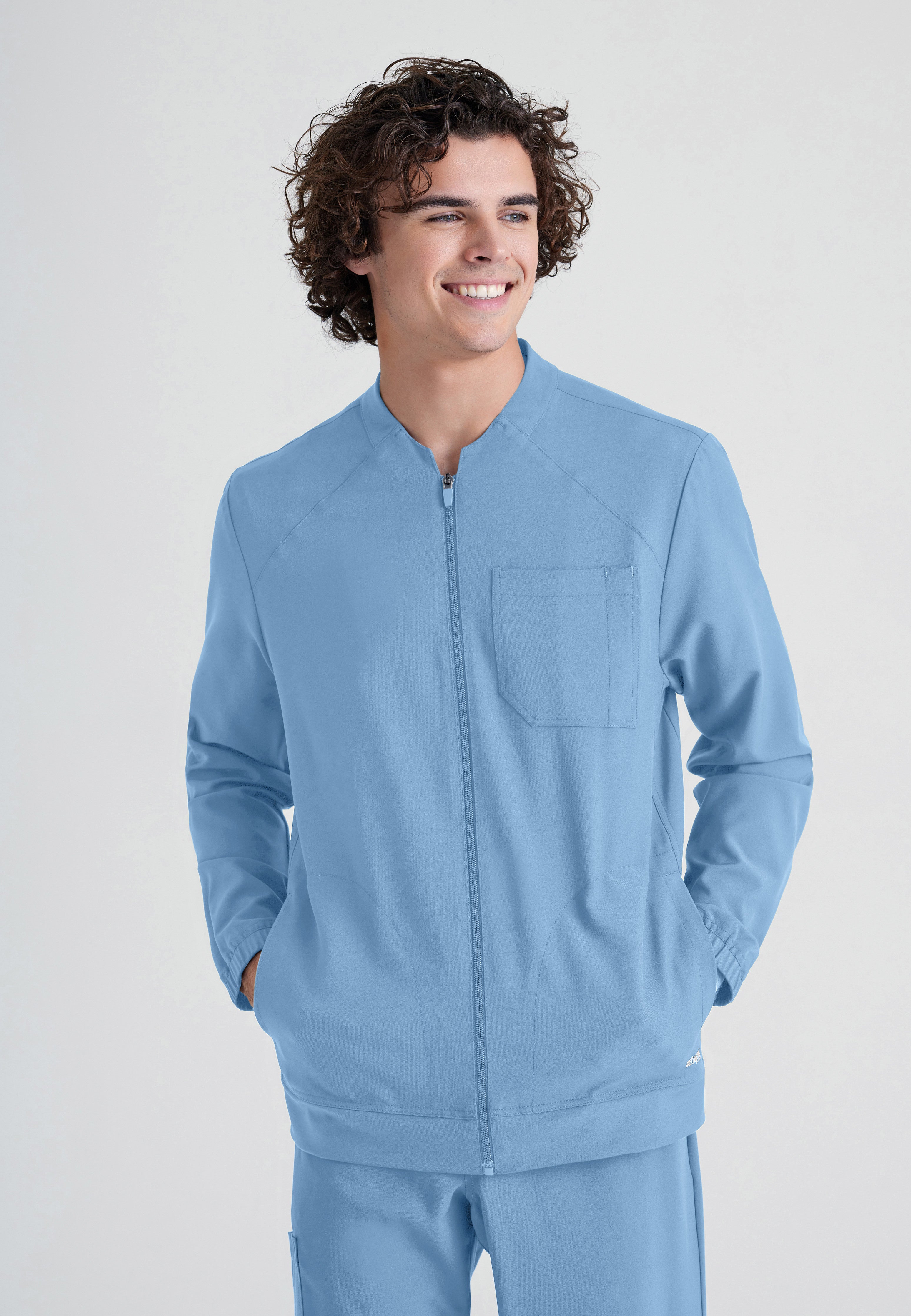 Front View of the Cycle 3-Pocket Crewneck Ciclo® Scrub Jacket in Ciel Blue from Grey's Anatomy™ by Barco Evolve