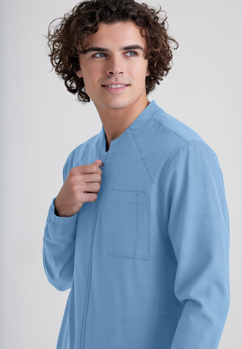 Detail Shot of the Cycle 3-Pocket Crewneck Ciclo® Scrub Jacket in Ciel Blue from Grey's Anatomy™ by Barco Evolve