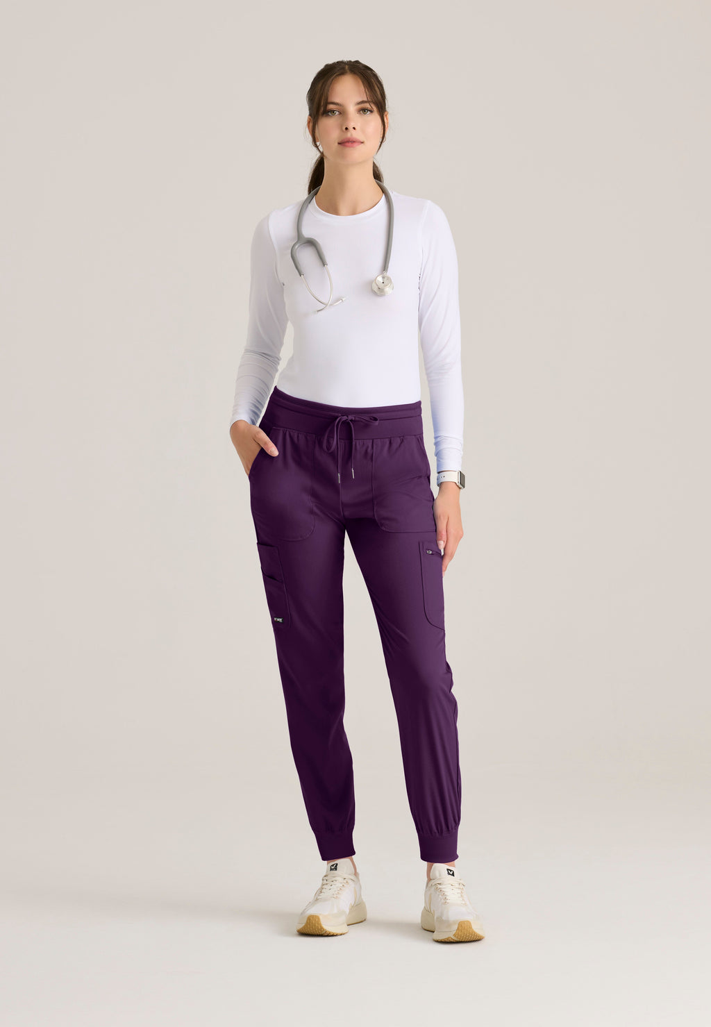 Full Body View of the Carly Jogger Scrub Pant in Eggplant from Grey's Anatomy™ by Barco Spandex Stretch