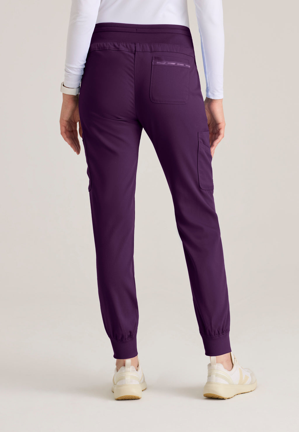 Back View of the Carly Jogger Scrub Pant in Eggplant from Grey's Anatomy™ by Barco Spandex Stretch