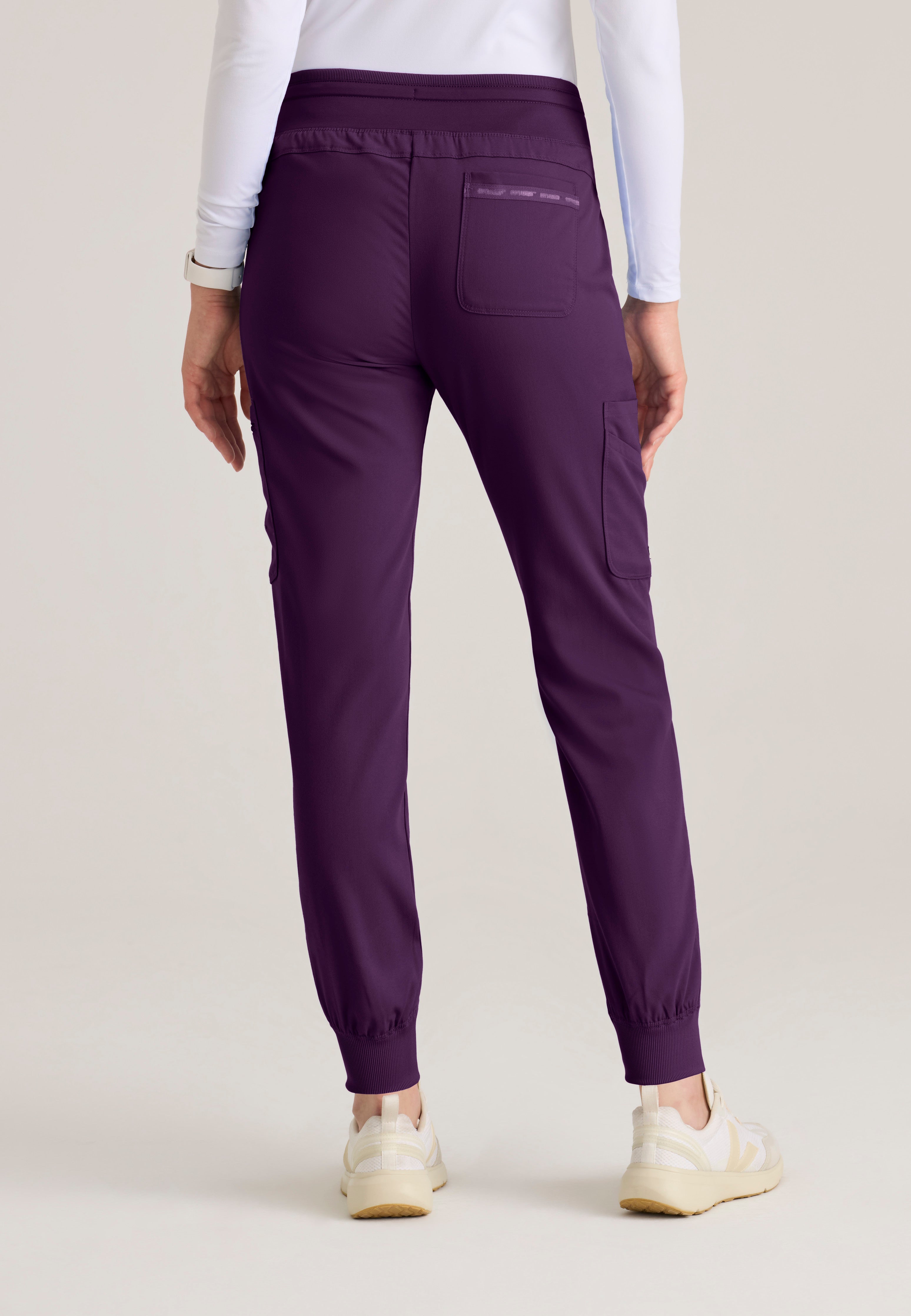 Back View of the Carly Jogger Scrub Pant in Eggplant from Grey's Anatomy™ by Barco Spandex Stretch