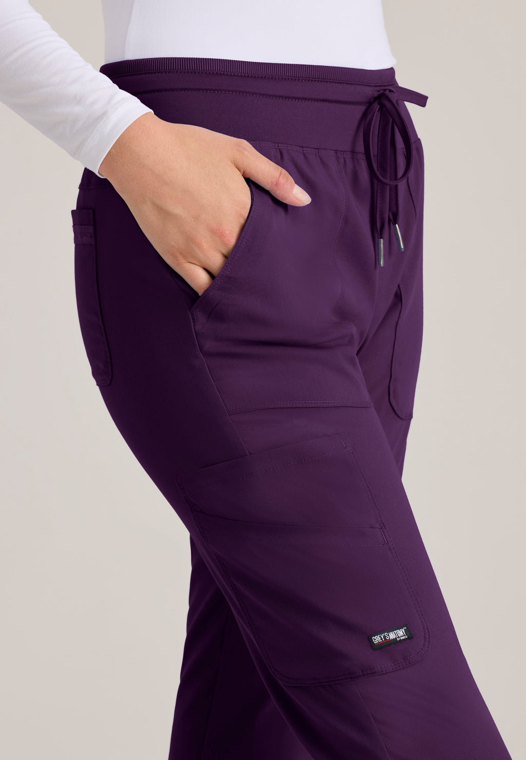 Detail Shot of the Carly Jogger Scrub Pant in Eggplant from Grey's Anatomy™ by Barco Spandex Stretch
