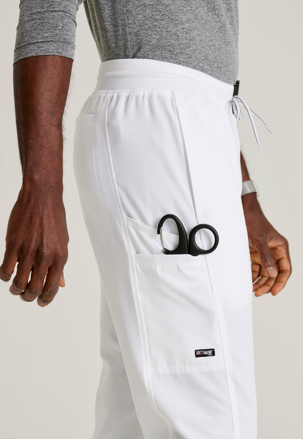 Detail Shot of the Hudson Straight Leg Drawcord Pant in White from Grey's Anatomy™ by Barco Spandex Stretch