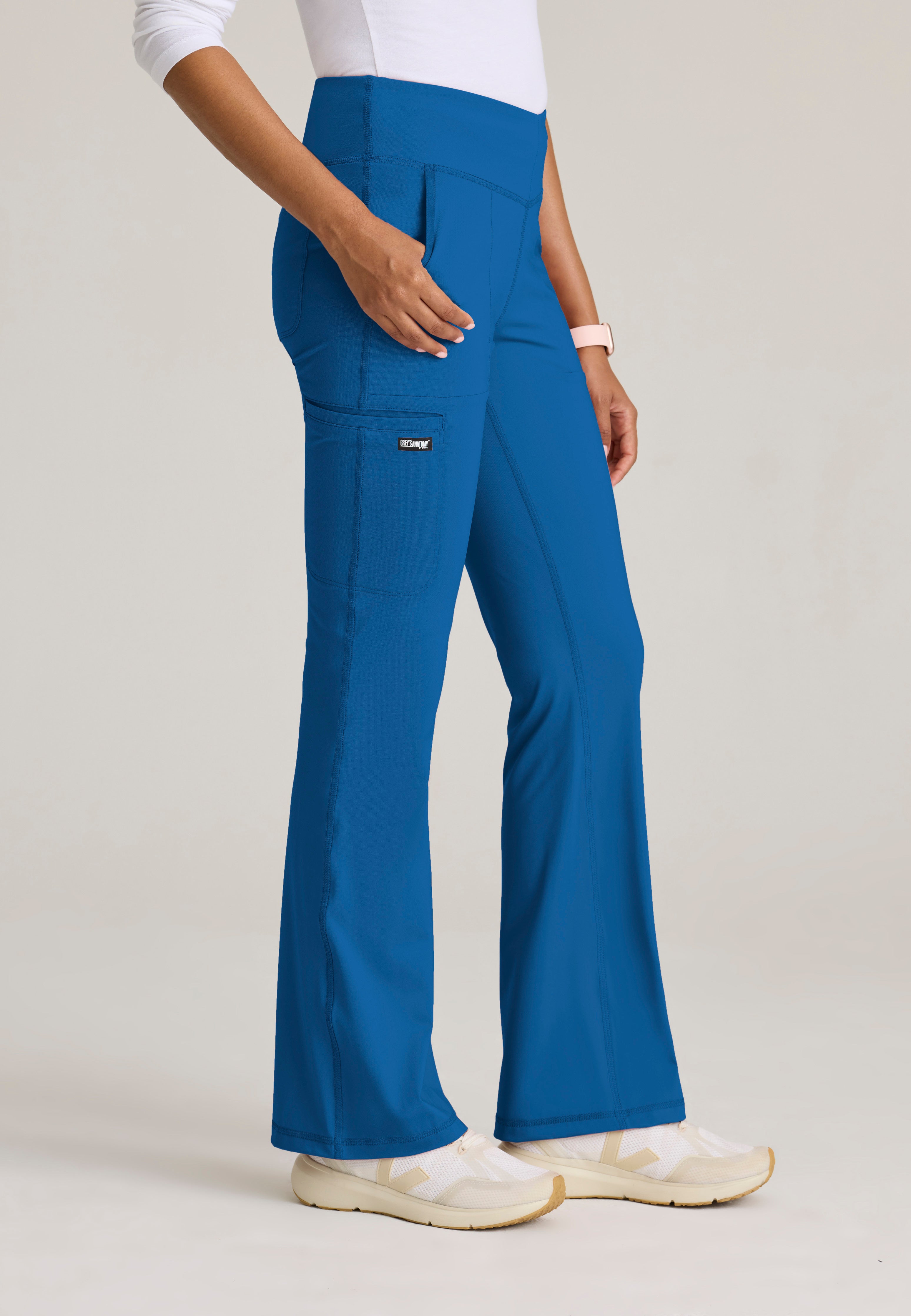 Side View of the Swift V-Front Knit Pant in New Royal from Grey's Anatomy™ by Barco Knit Stretch