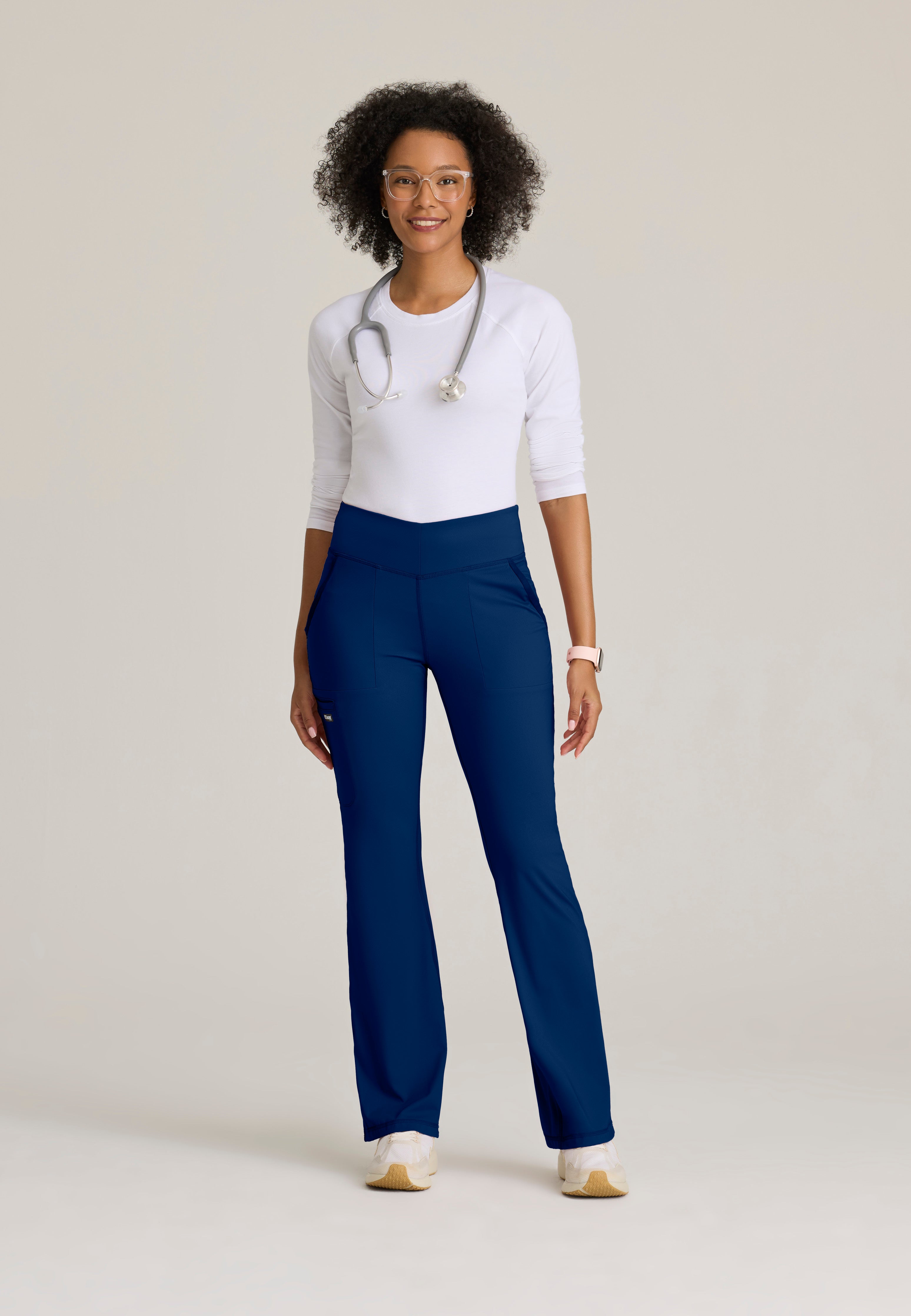 Full Body View of the Swift V-Front Knit Pant in Indigo from Grey's Anatomy™ by Barco Knit Stretch