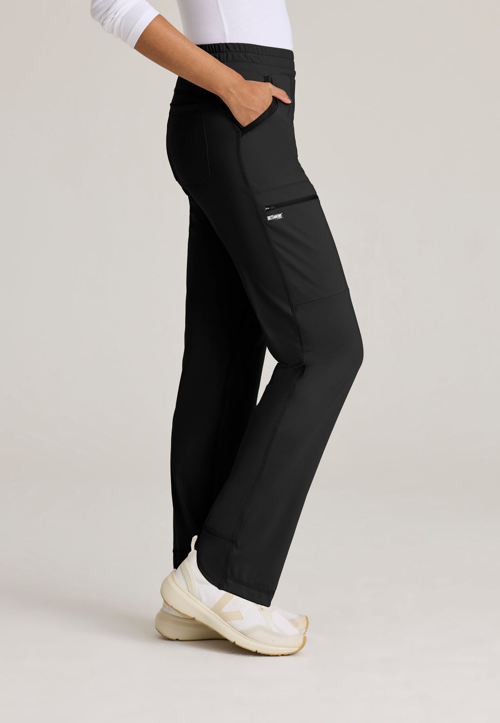 Side View of the Momentum Straight Leg Knit Pant in Black from Grey's Anatomy™ by Barco Knit Stretch