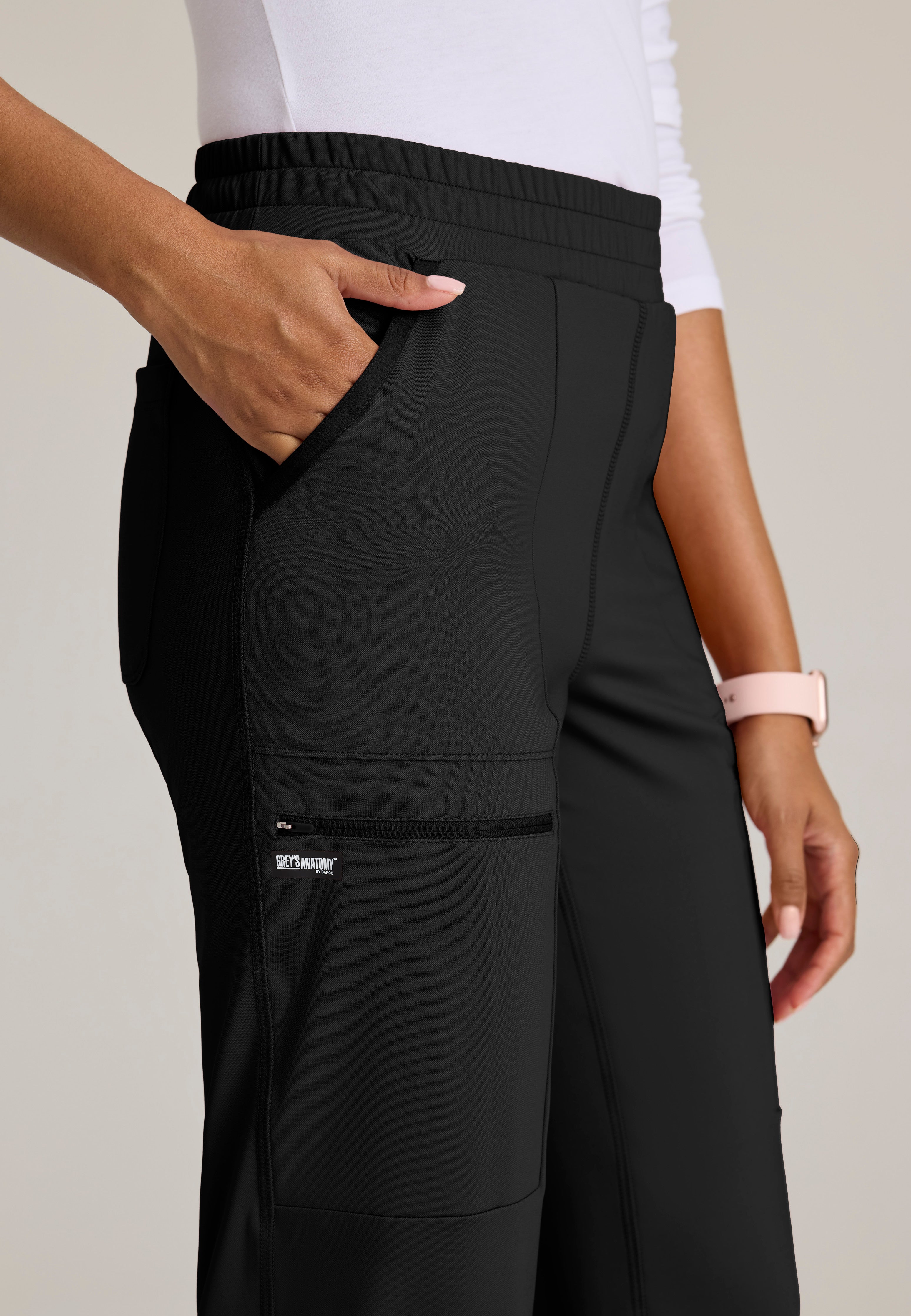 Detail Shot of the Momentum Straight Leg Knit Pant in Black from Grey's Anatomy™ by Barco Knit Stretch