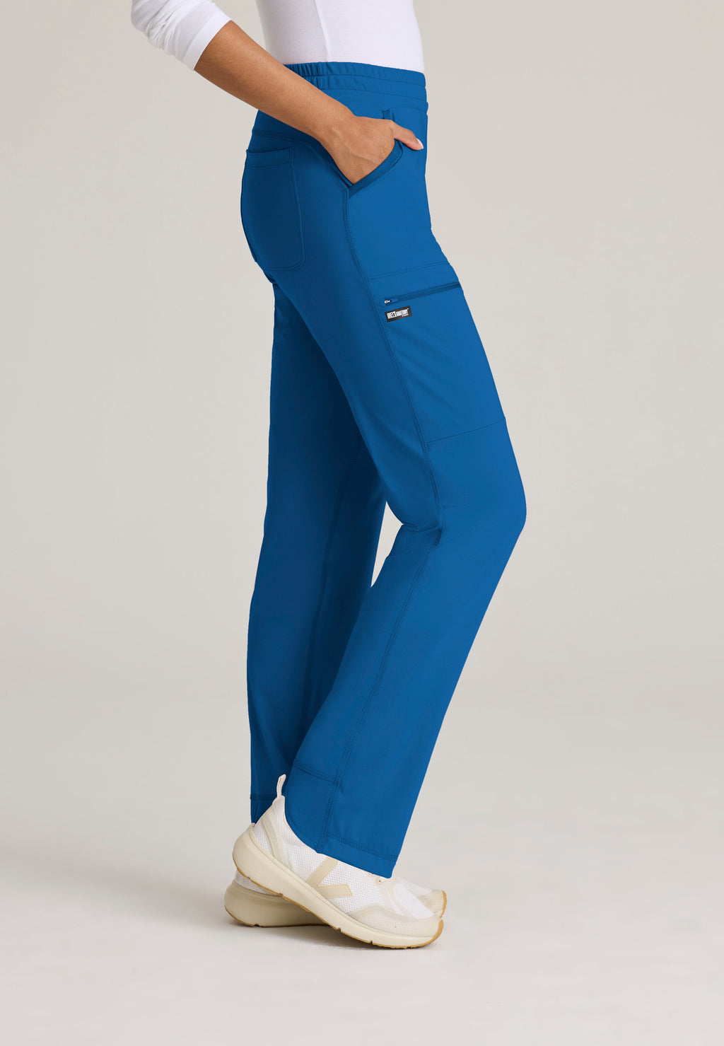 Side View of the Momentum Straight Leg Knit Pant in New Royal from Grey's Anatomy™ by Barco Knit Stretch