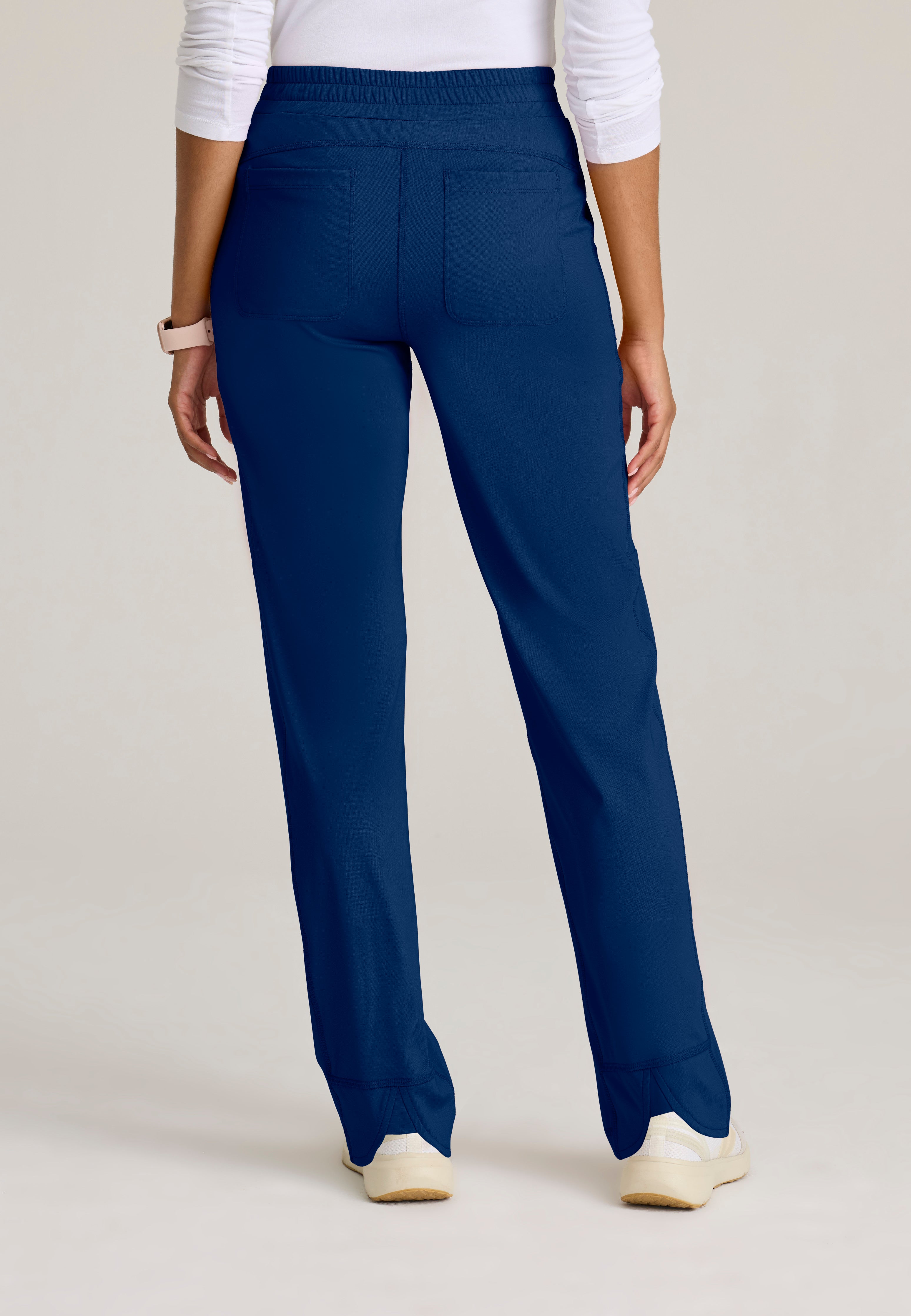 Back View of the Momentum Straight Leg Knit Pant in Indigo from Grey's Anatomy™ by Barco Knit Stretch