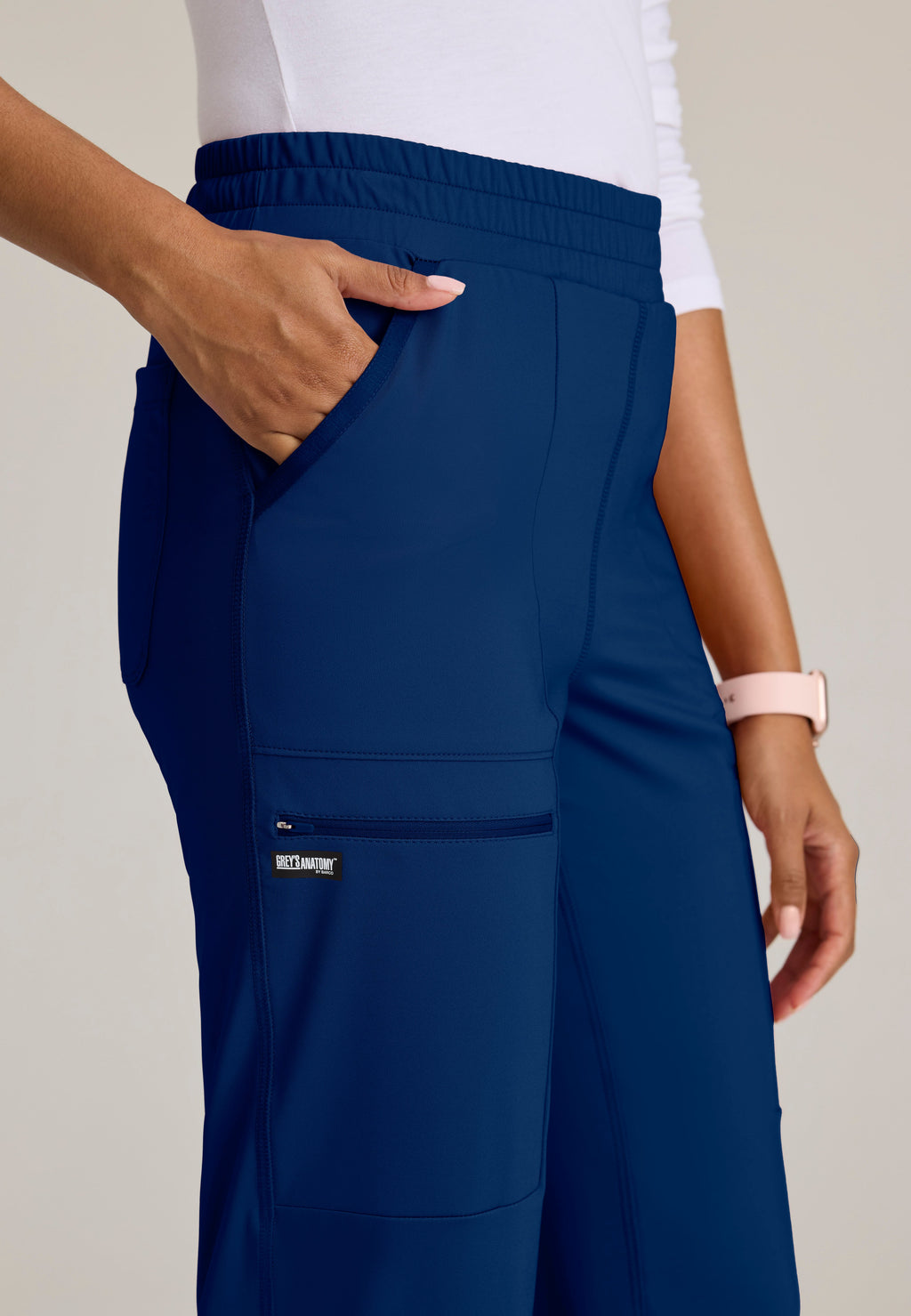 Detail Shot of the Momentum Straight Leg Knit Pant in Indigo from Grey's Anatomy™ by Barco Knit Stretch