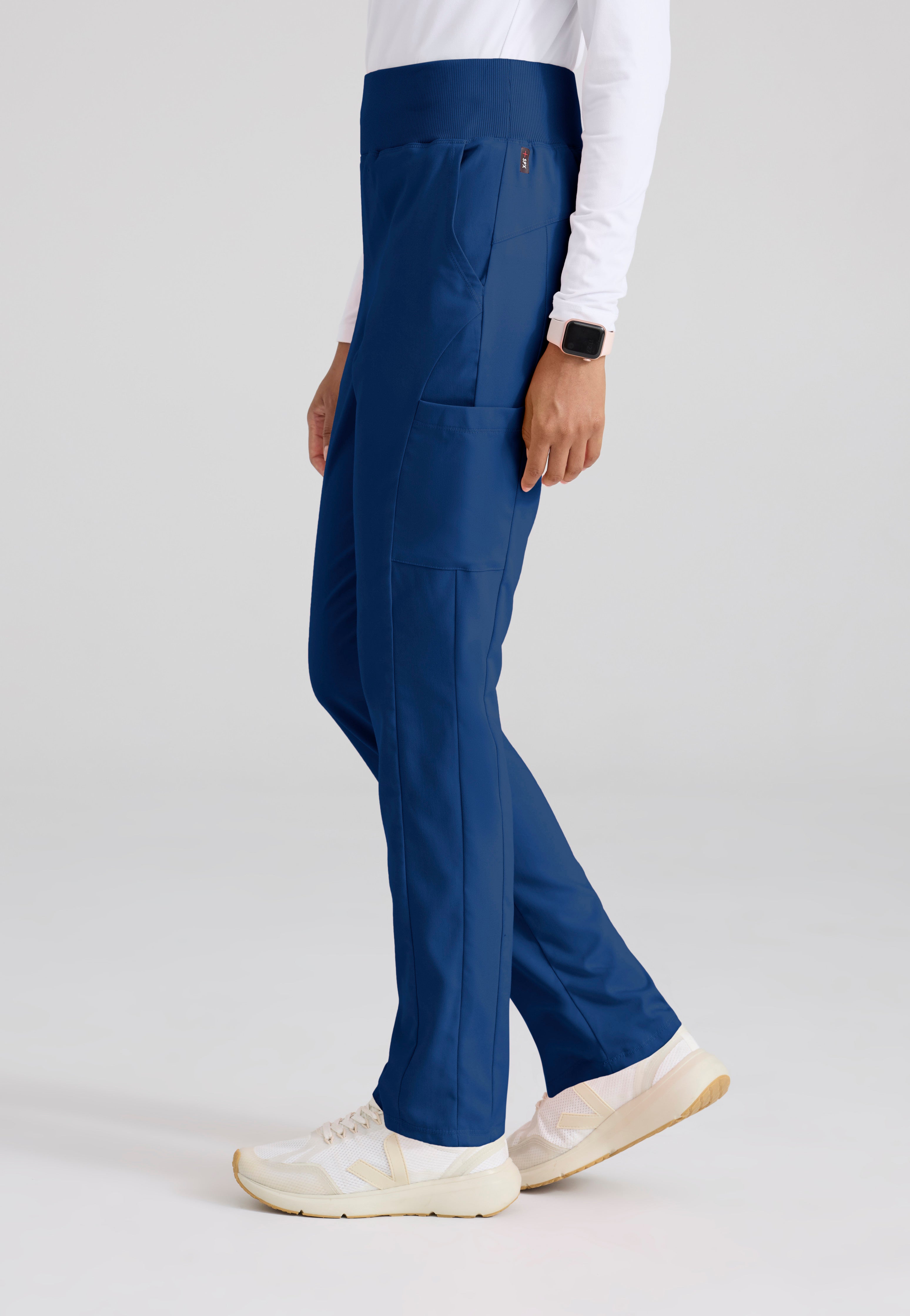 Side View of the Renee 6-Pocket Cargo Knit Scrub Pant in Indigo from Grey's Anatomy™ by Barco Spandex Stretch