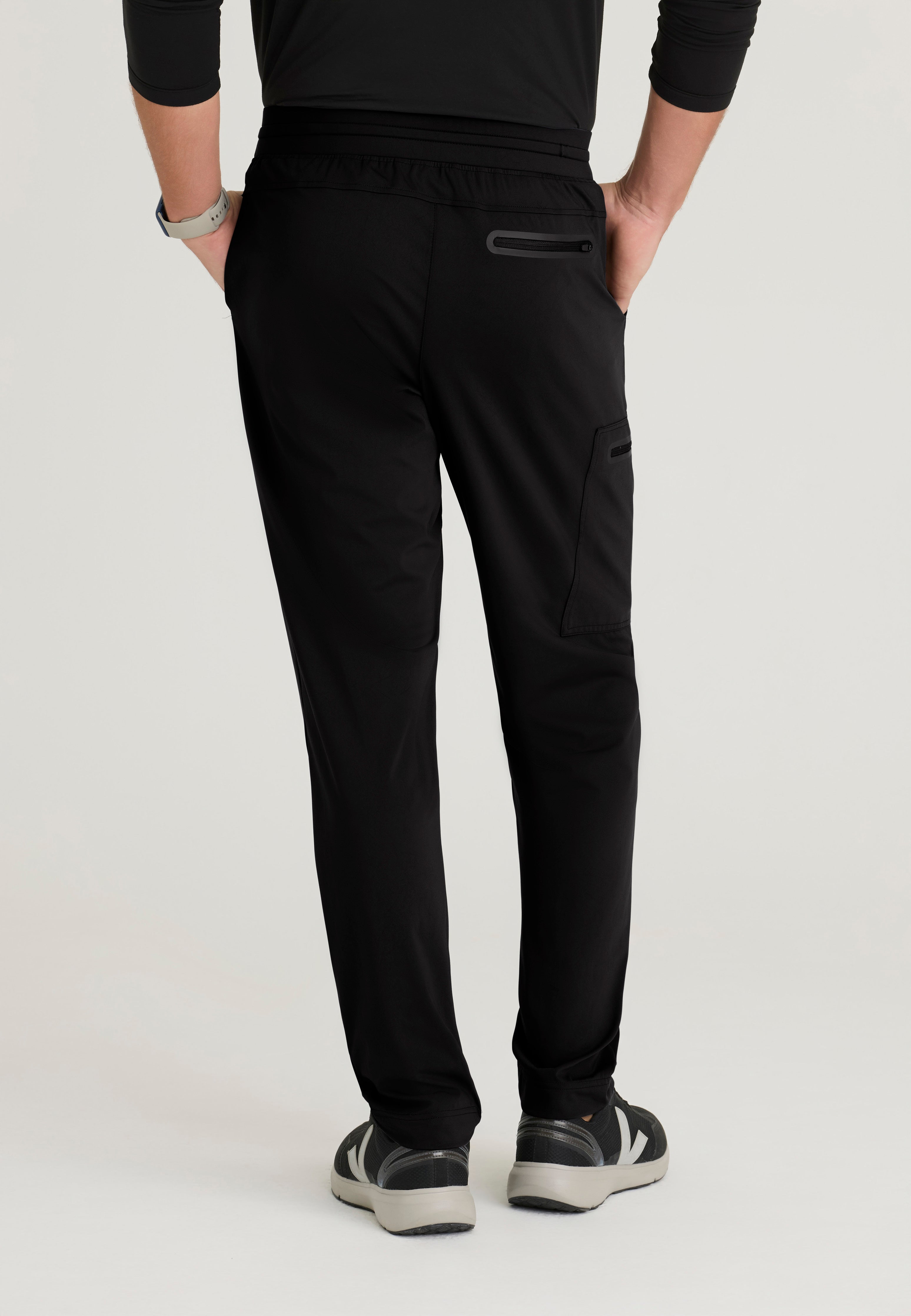 Back View of the Focus 4-Pocket Slim Straight Knit Pant in Black from Grey's Anatomy™ by Barco Knit Stretch