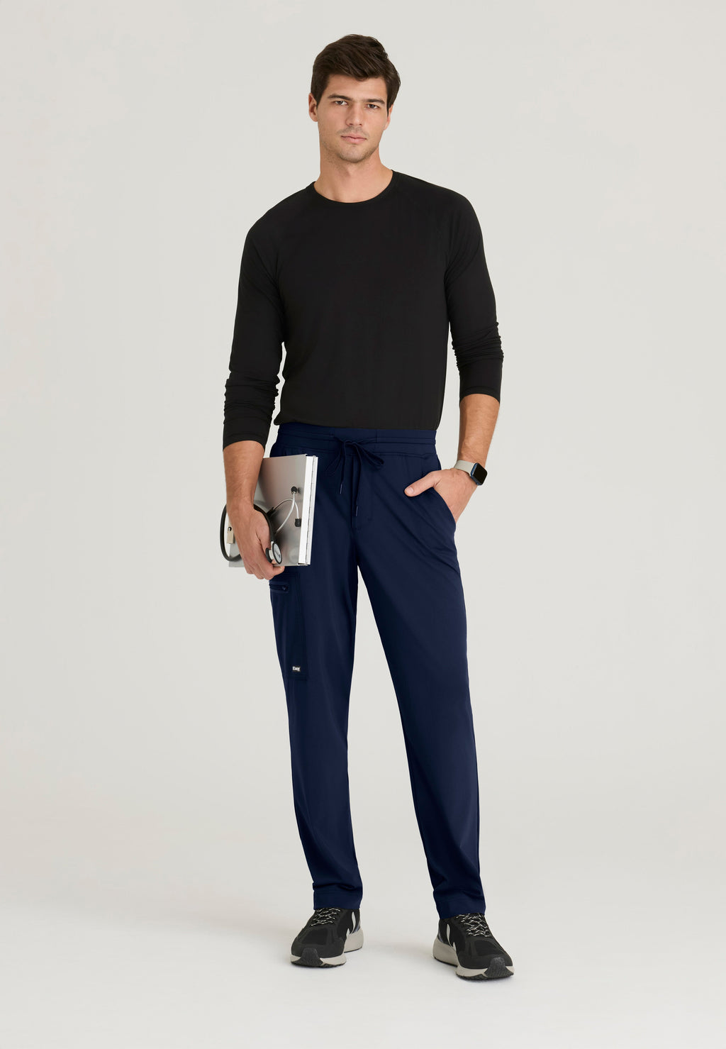 Full Body View of the Focus 4-Pocket Slim Straight Knit Pant in Indigo from Grey's Anatomy™ by Barco Knit Stretch