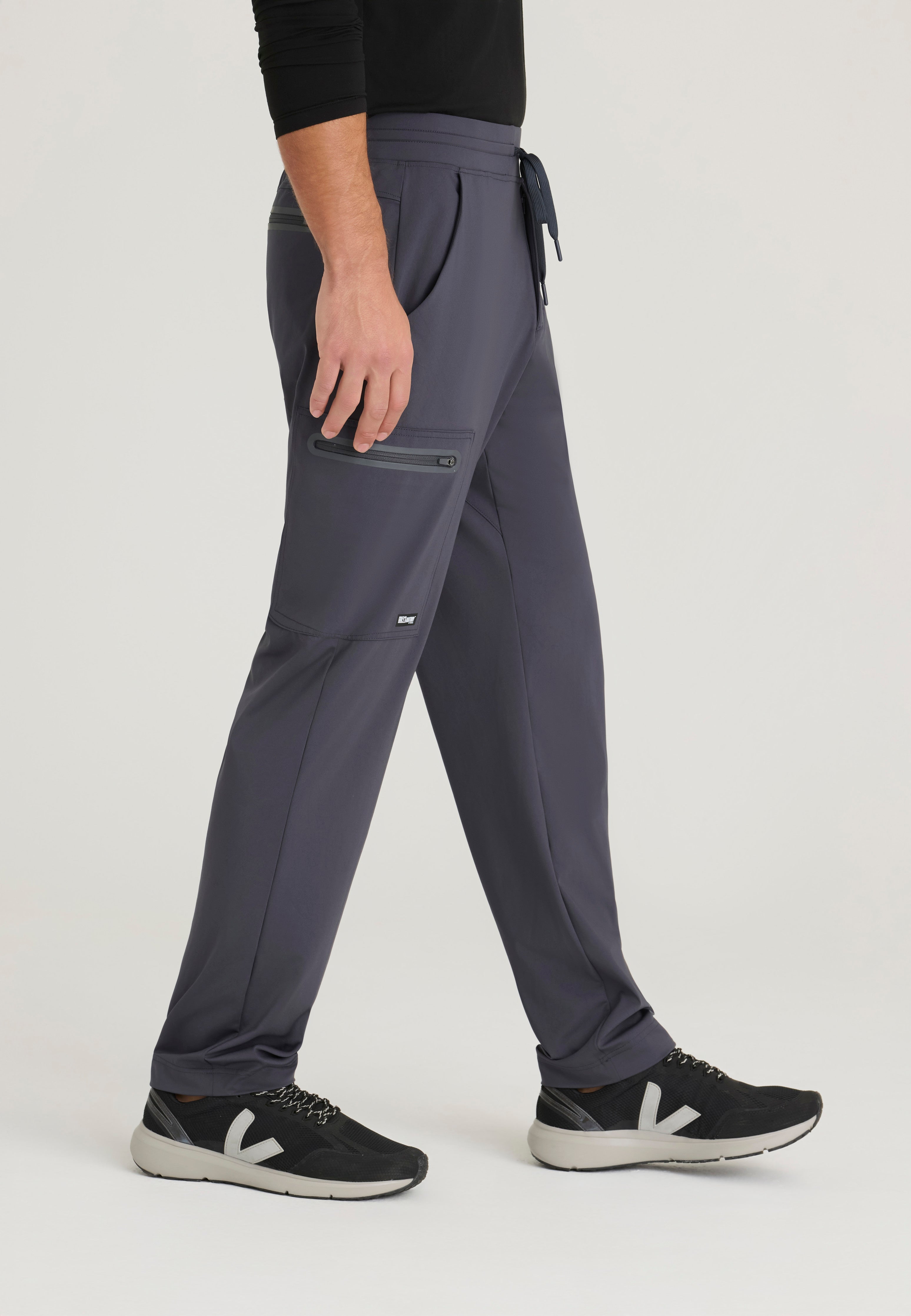 Side View of the Focus 4-Pocket Slim Straight Knit Pant in Steel from Grey's Anatomy™ by Barco Knit Stretch