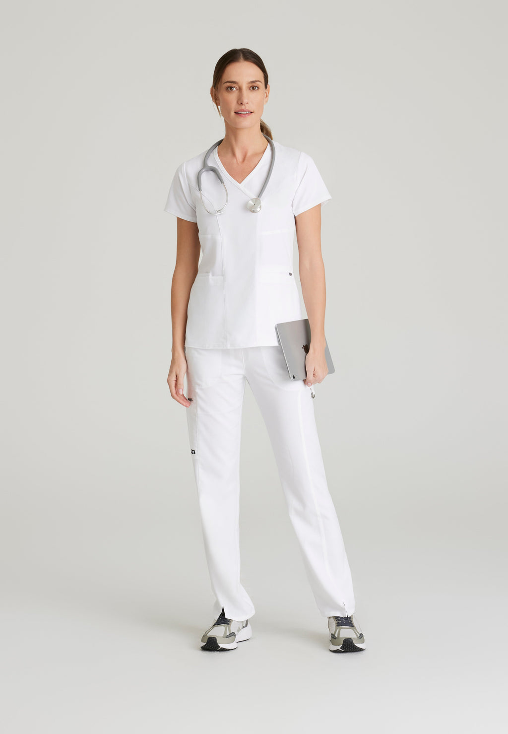 Full Body View of the Kim 3-Pocket Crossover V-Neck Scrub Top in White from Grey's Anatomy™ by Barco Spandex Stretch