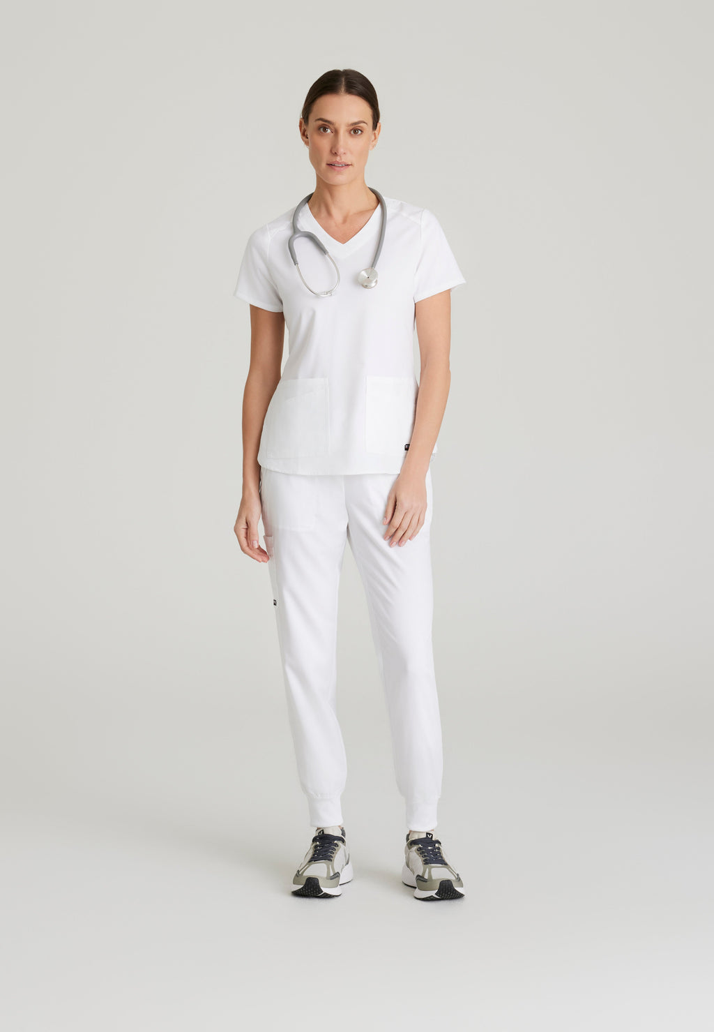Full Body View of the Emma 4-Pocket V-Neck Scrub Top in White from Grey's Anatomy™ by Barco Spandex Stretch
