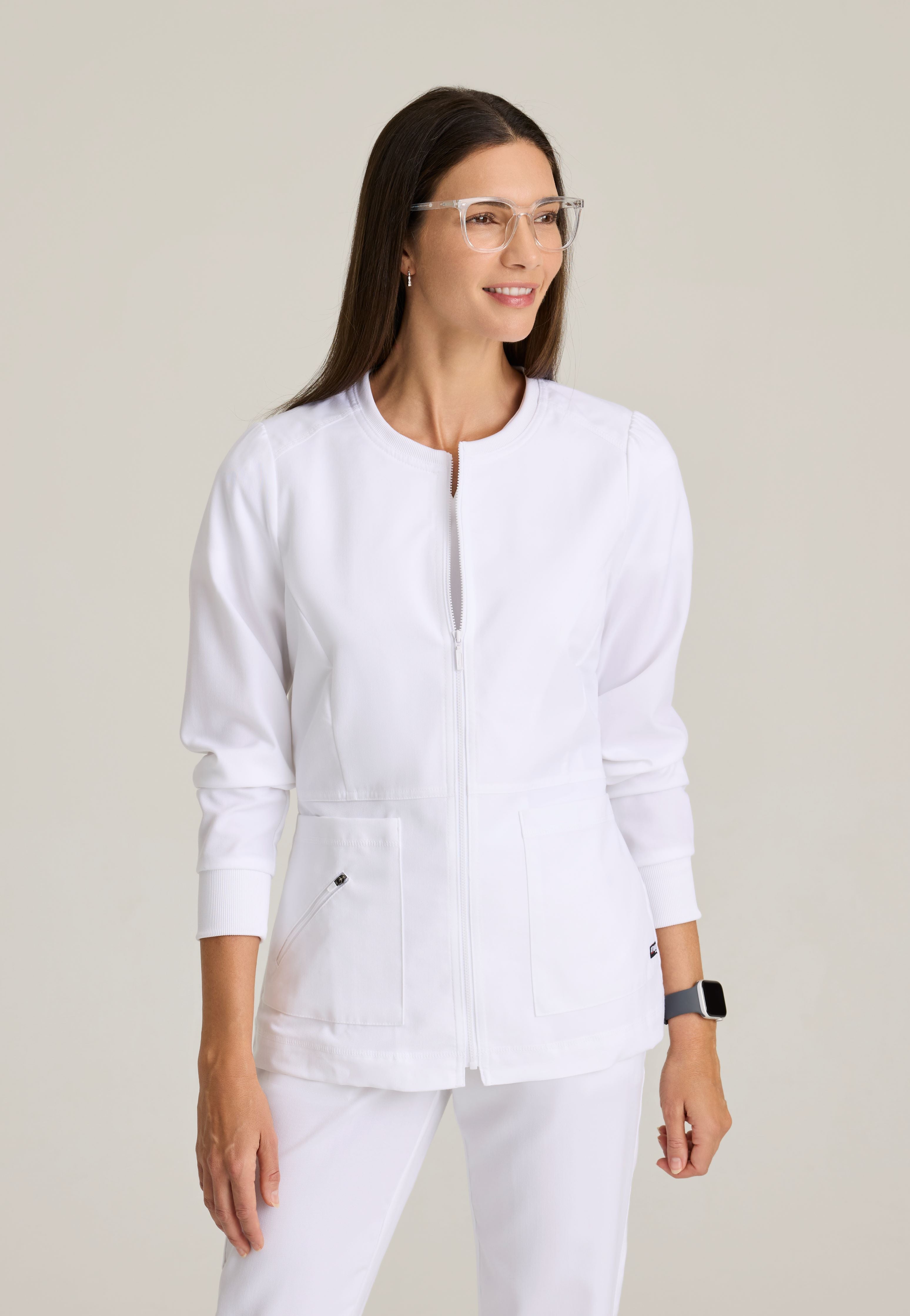 Front View of the Millie 3-Pocket Crewneck Scrub Jacket in White from Grey's Anatomy™ by Barco Spandex Stretch