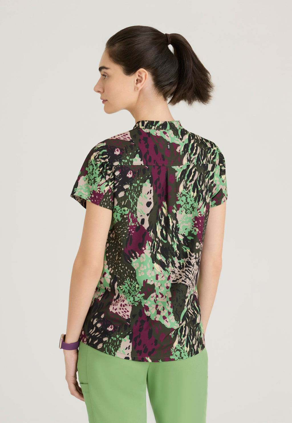 Back View of the Avery 2-Pocket Banded Collar Top from Grey's Anatomy™ by Barco Spandex Stretch