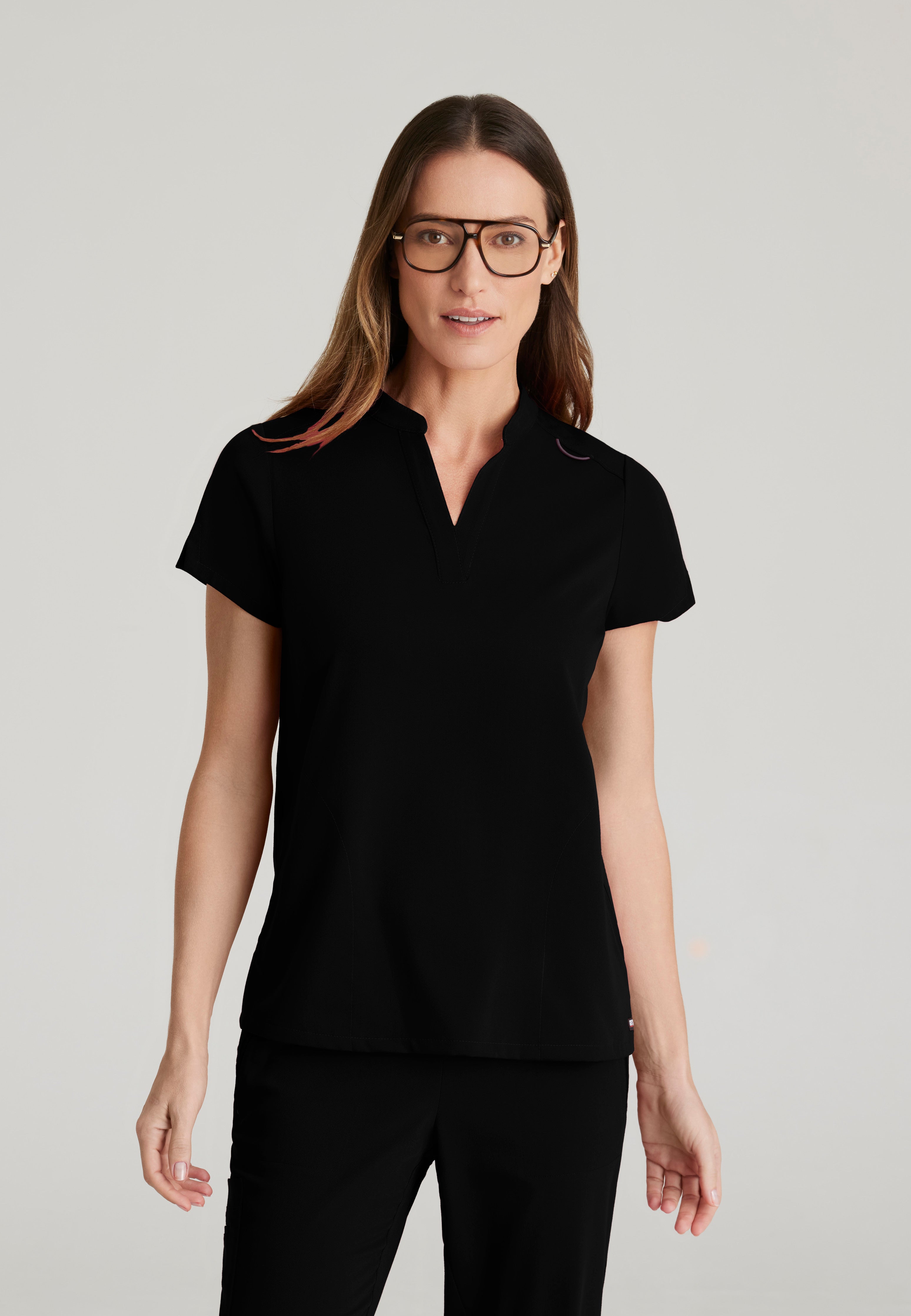 Front View of the Avery 2-Pocket Banded Collar Top in Black from Grey's Anatomy™ by Barco Spandex Stretch