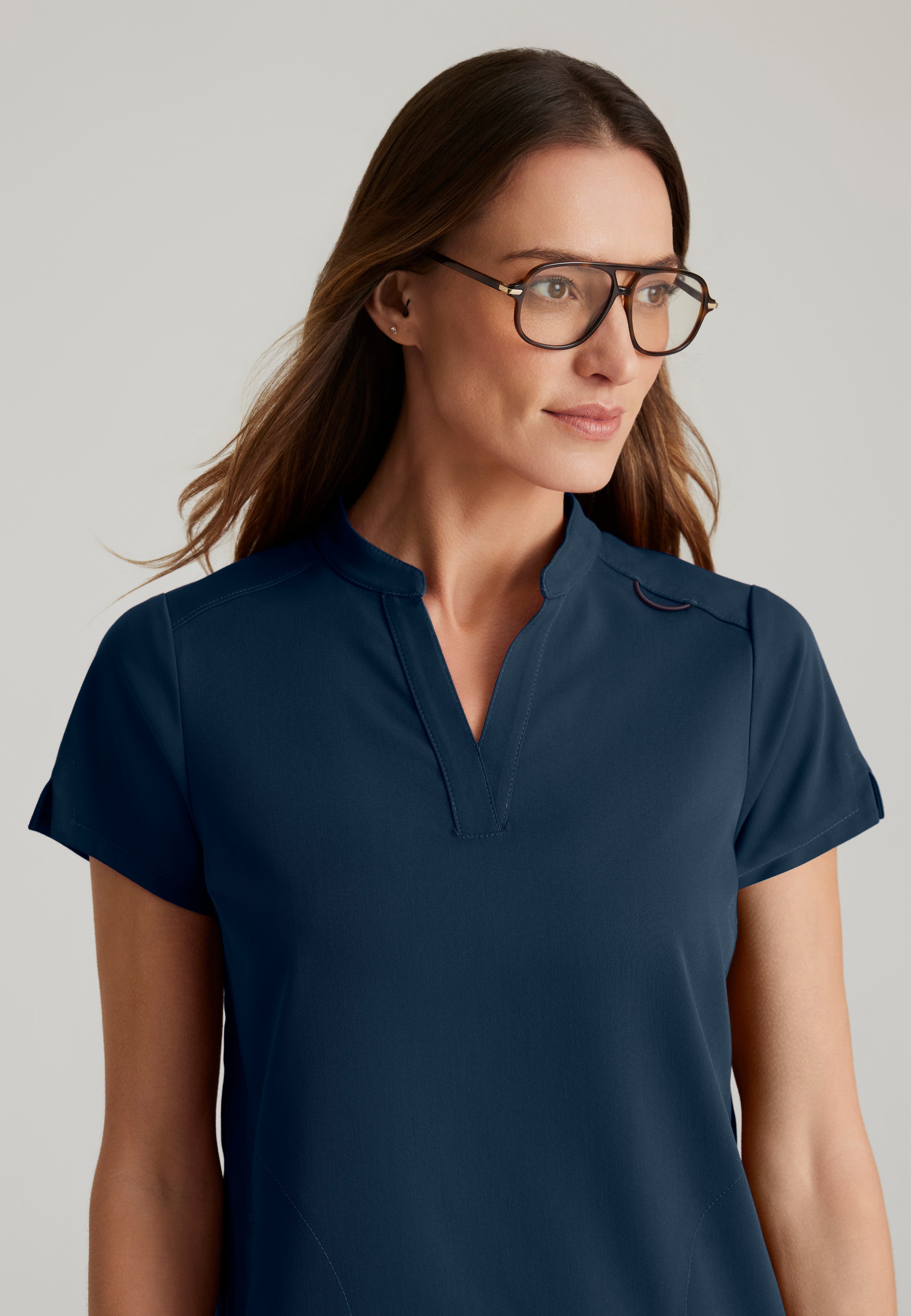 Detail Shot of the Avery 2-Pocket Banded Collar Top in Steel from Grey's Anatomy™ by Barco Spandex Stretch