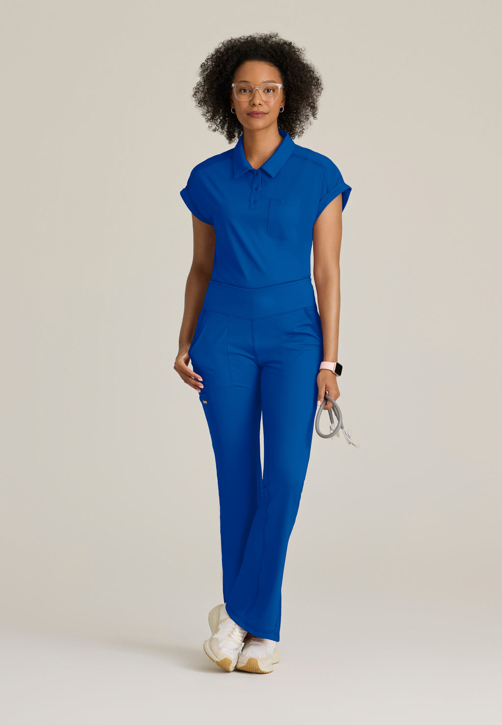 Full Body View of the Renew Snap Placket Knit Scrub Top in New Royal from Grey's Anatomy™ by Barco Knit Stretch