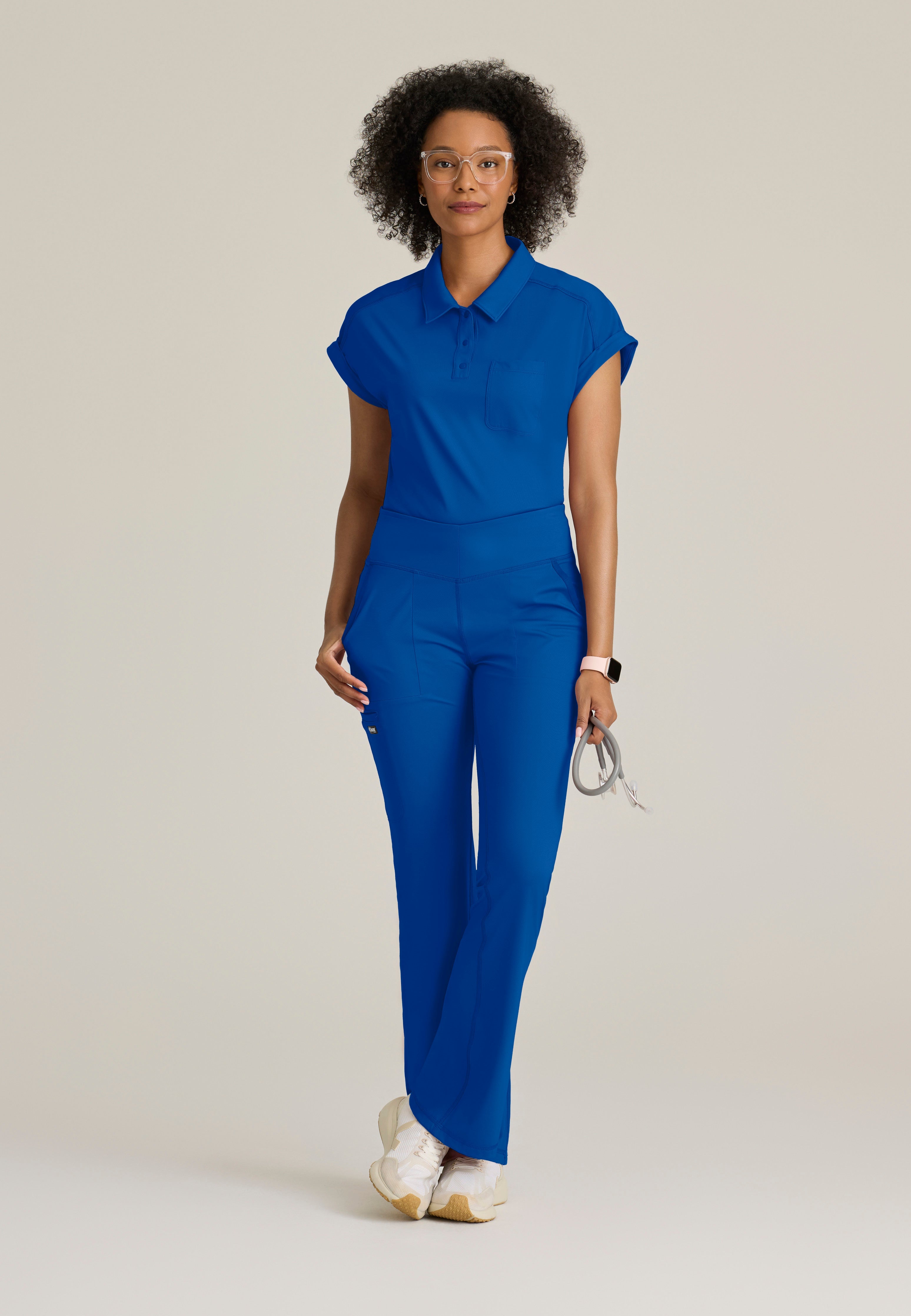 Full Body View of the Renew Snap Placket Knit Scrub Top in New Royal from Grey's Anatomy™ by Barco Knit Stretch