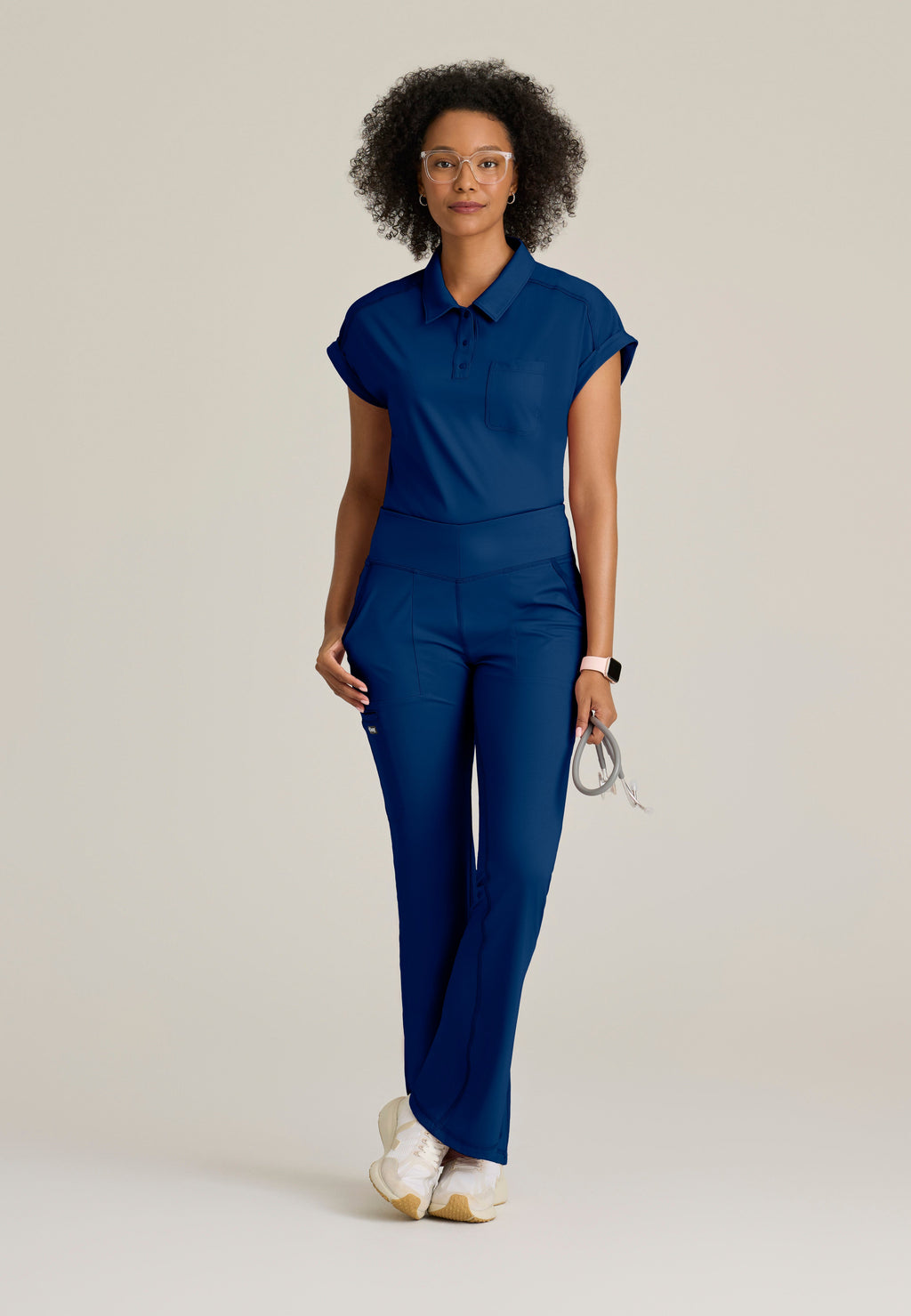 Full Body View of the Renew Snap Placket Knit Scrub Top in Indigo from Grey's Anatomy™ by Barco Knit Stretch