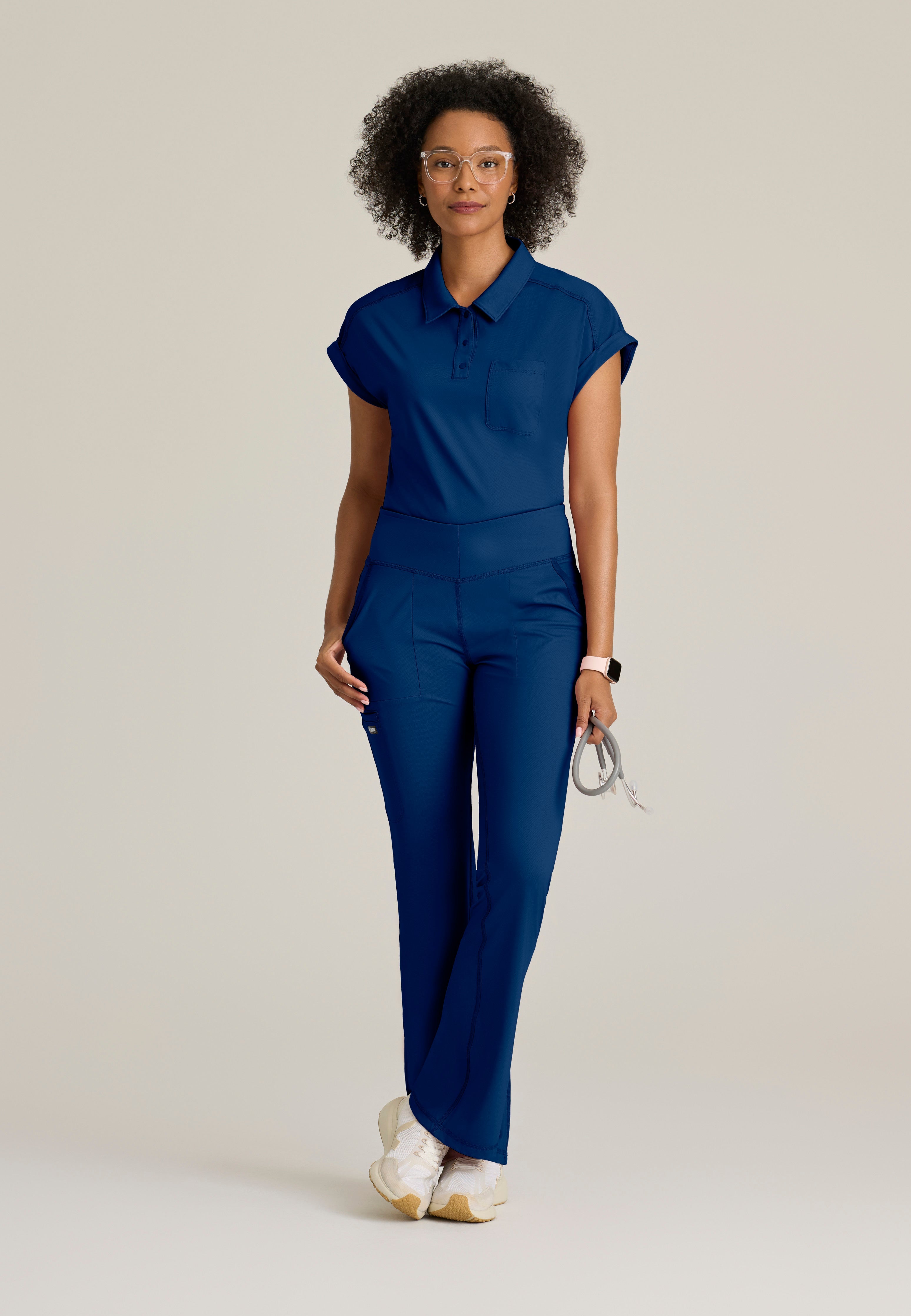 Full Body View of the Renew Snap Placket Knit Scrub Top in Indigo from Grey's Anatomy™ by Barco Knit Stretch