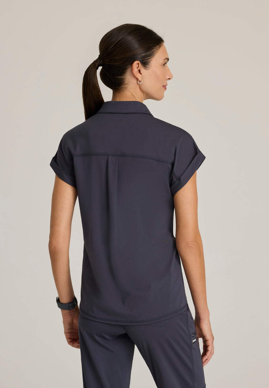 Back View of the Renew Snap Placket Knit Scrub Top in Steel from Grey's Anatomy™ by Barco Knit Stretch