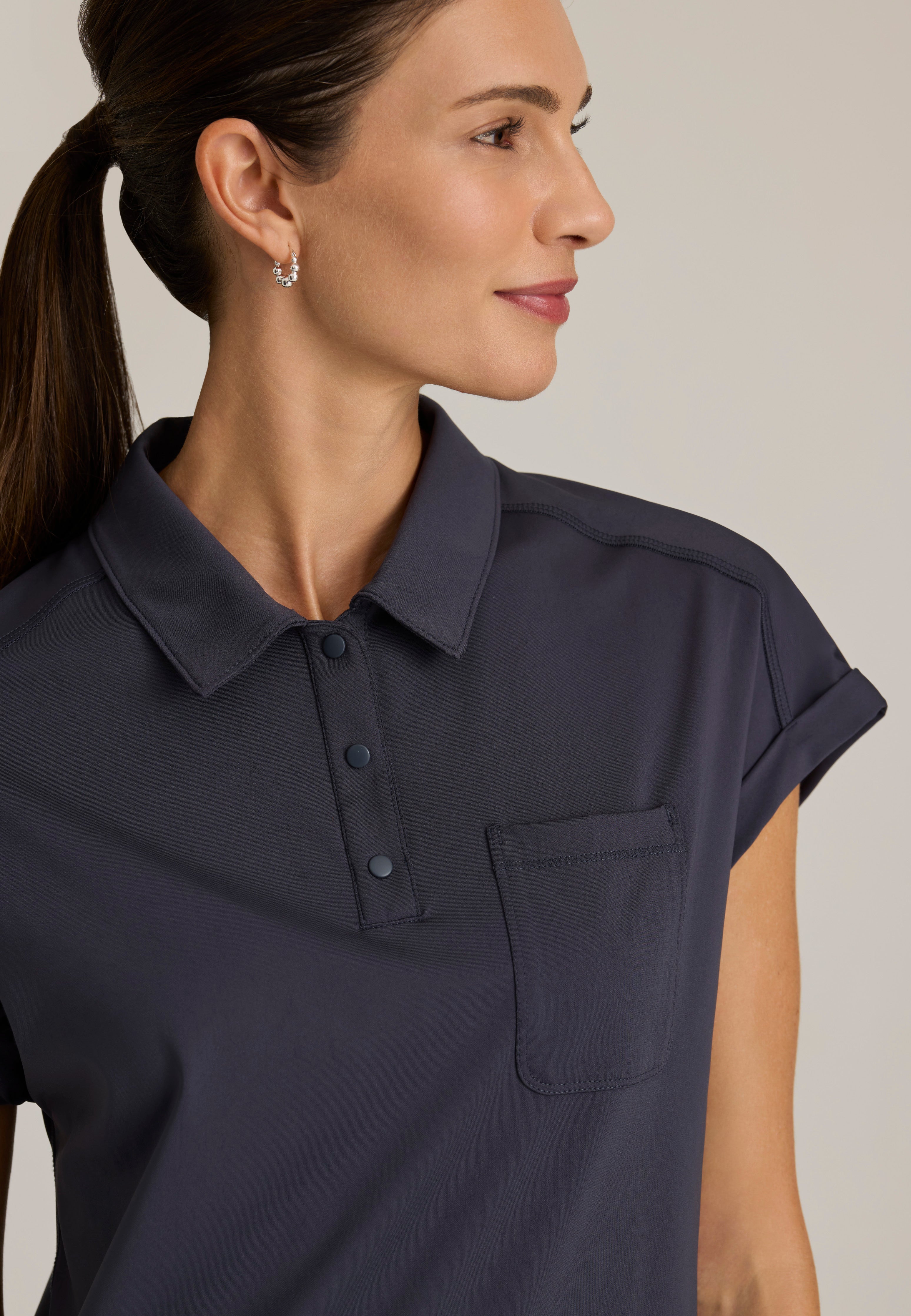 Detail Shot of the Renew Snap Placket Knit Scrub Top in Steel from Grey's Anatomy™ by Barco Knit Stretch