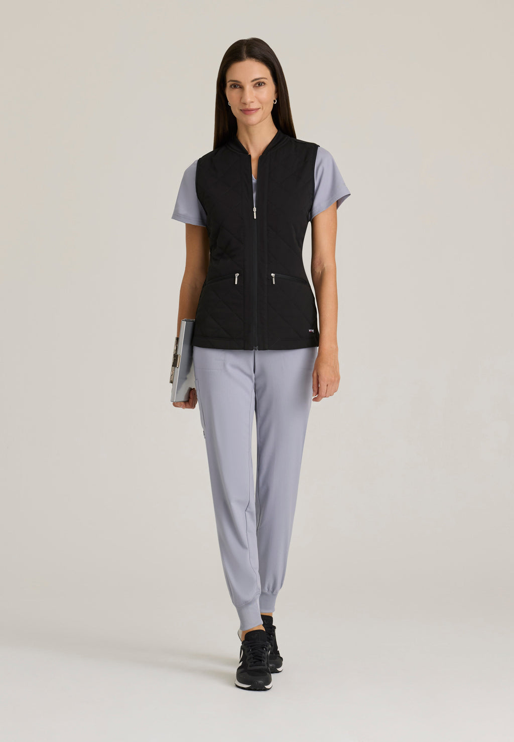 Full Body View of the Cristina 2-Pocket Quilted Scrub Vest in Black from Grey's Anatomy™ by Barco Spandex Stretch