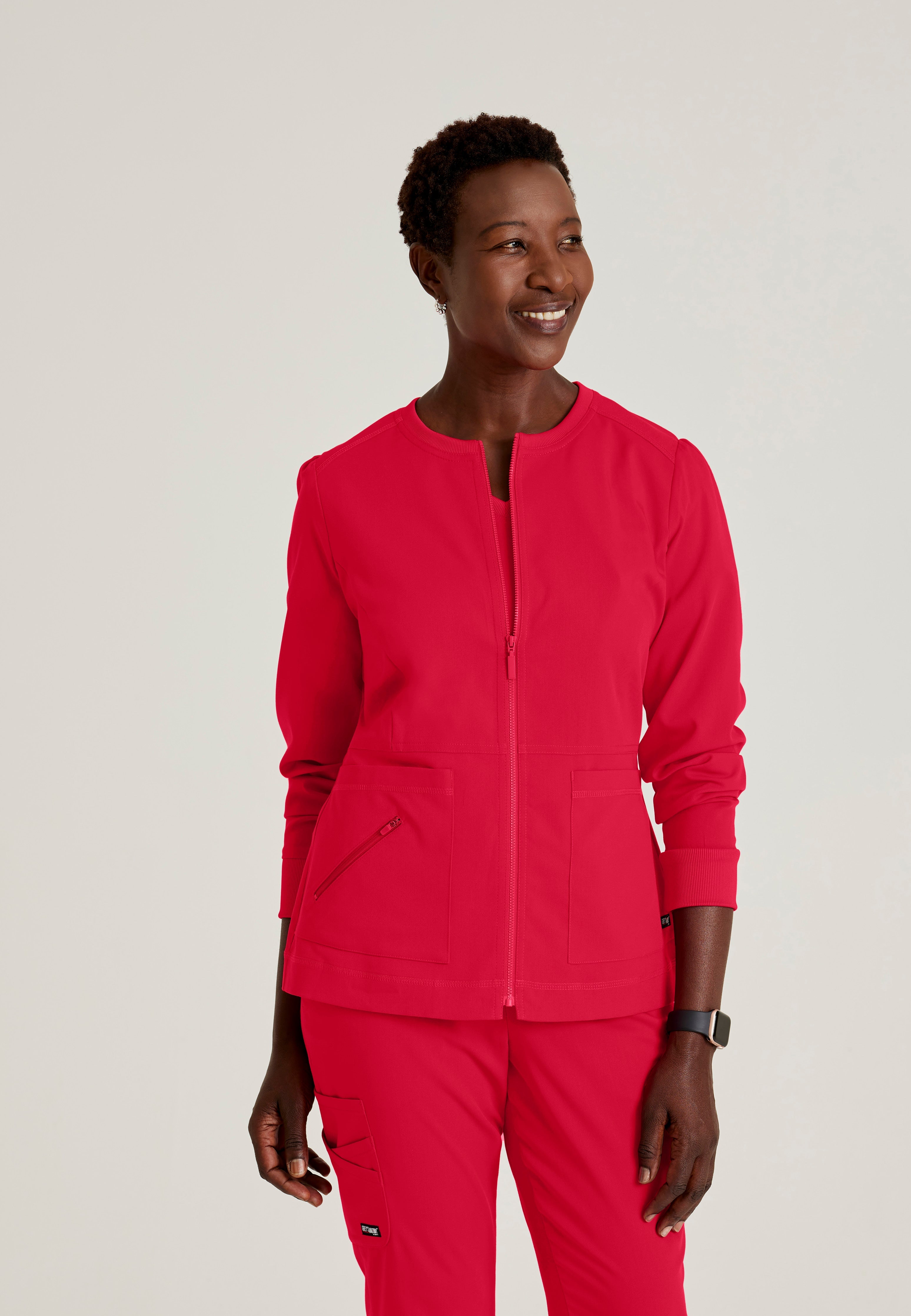 Front View of the Millie 3-Pocket Crewneck Scrub Jacket in Scarlet Red from Grey's Anatomy™ by Barco Spandex Stretch