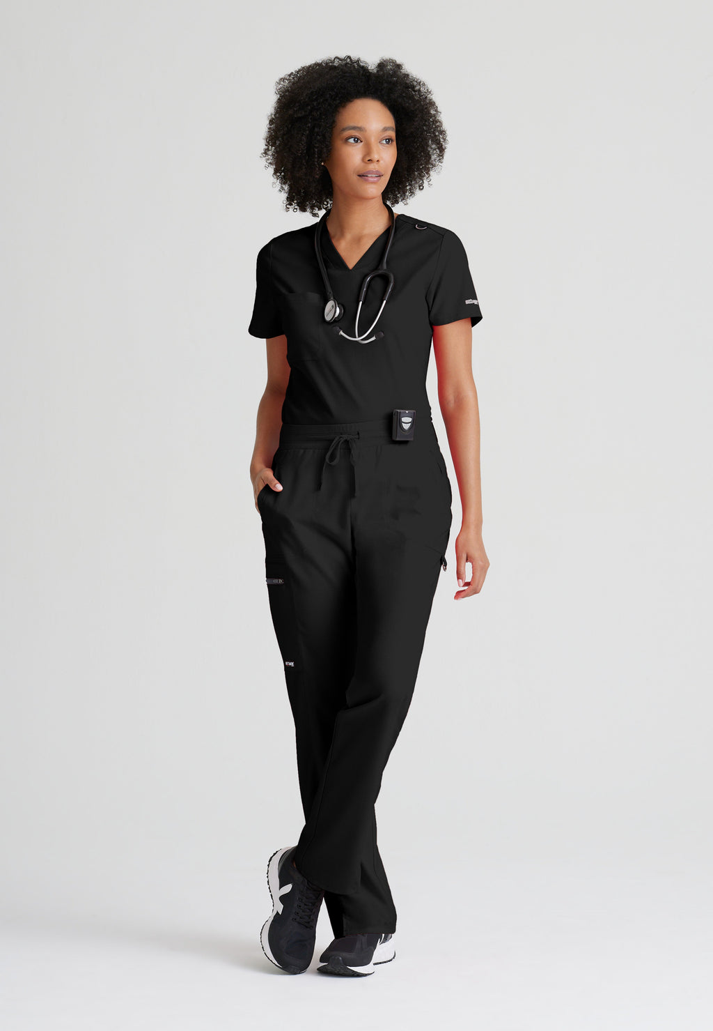 Full Body View of the Bree 1-Pocket Tuck-In Scrub Top in Black from Grey's Anatomy™ by Barco Spandex Stretch