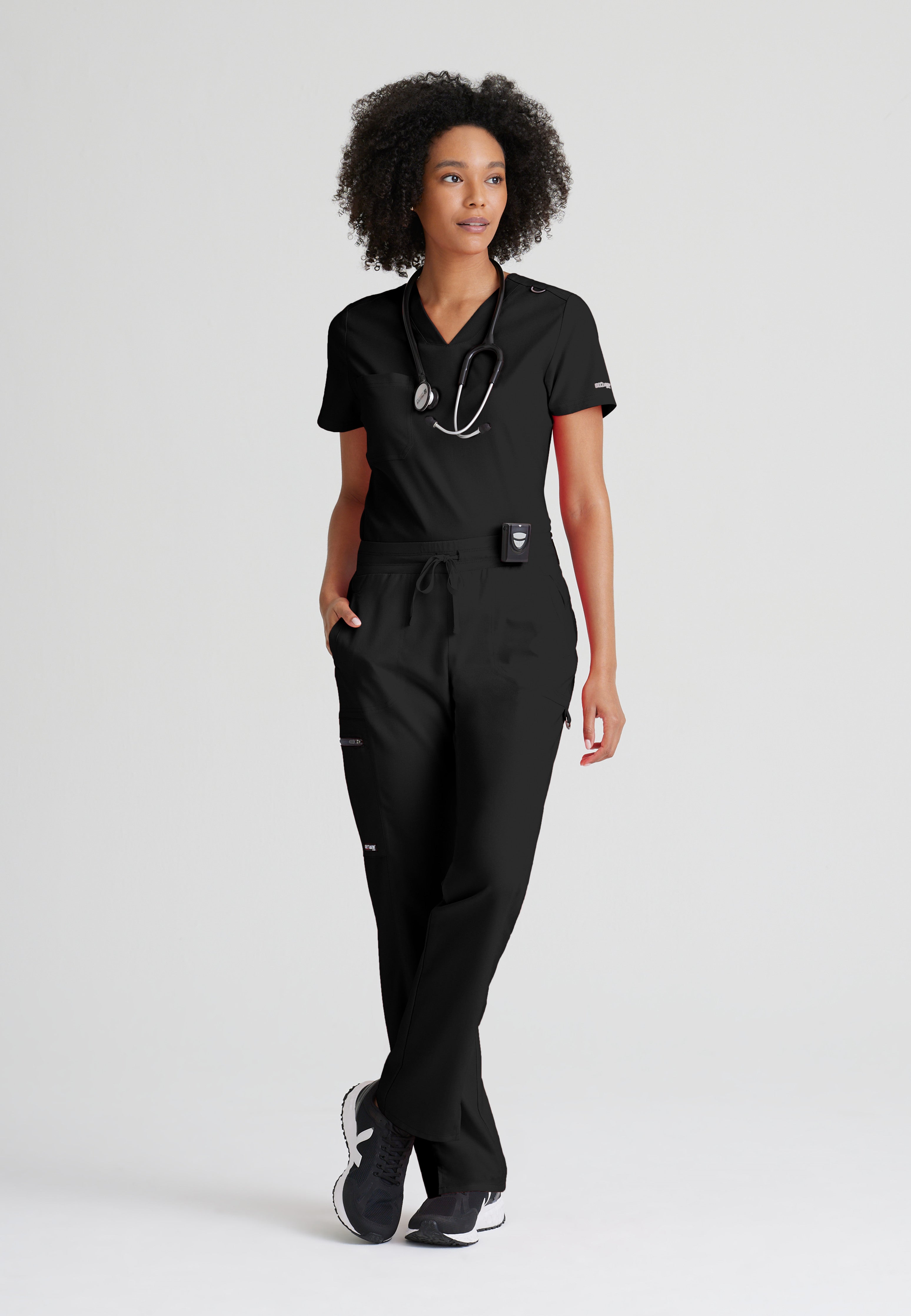Full Body View of the Bree 1-Pocket Tuck-In Scrub Top in Black from Grey's Anatomy™ by Barco Spandex Stretch
