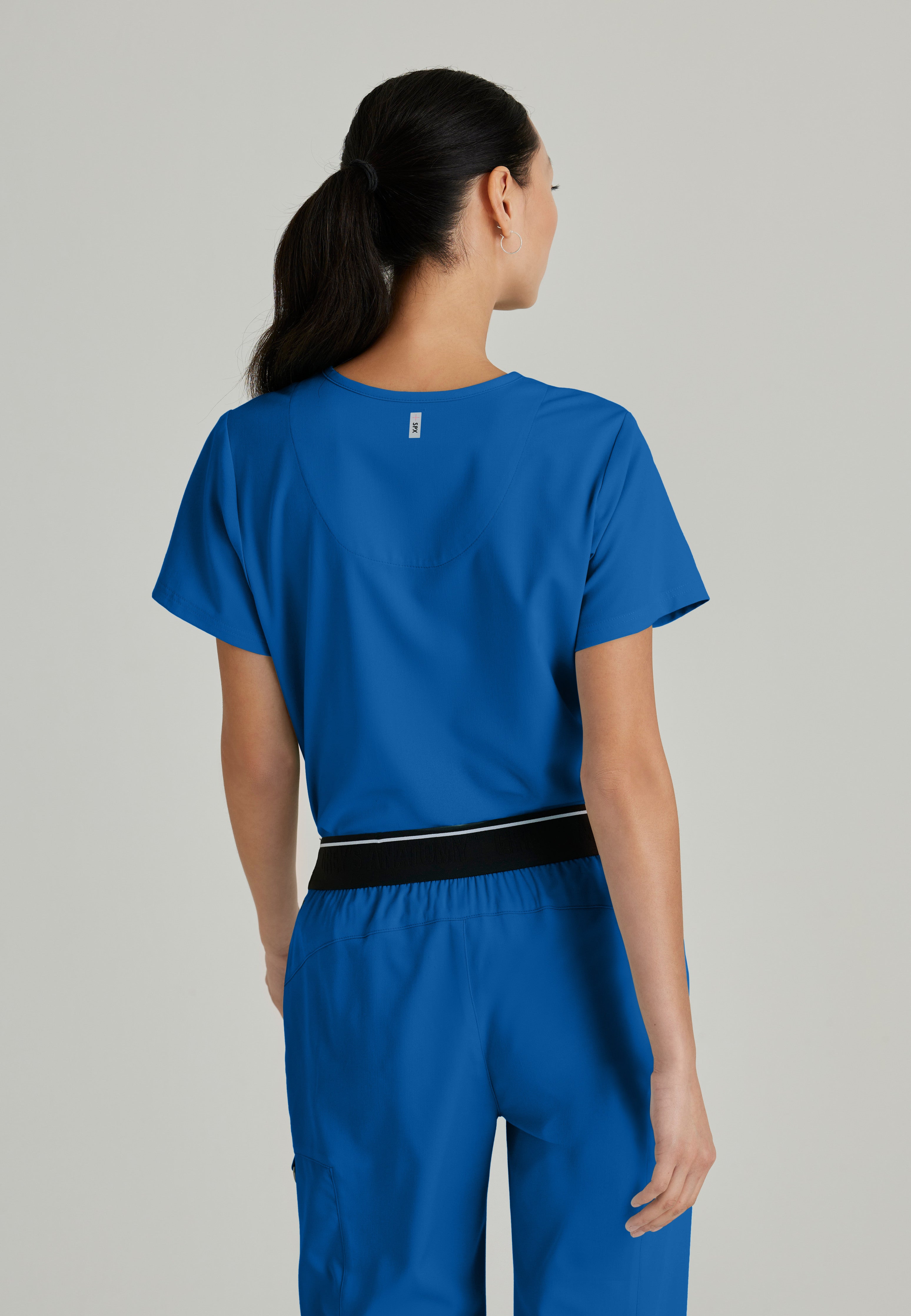 Side View of the Bree 1-Pocket Tuck-In Scrub Top in New Royal from Grey's Anatomy™ by Barco Spandex Stretch
