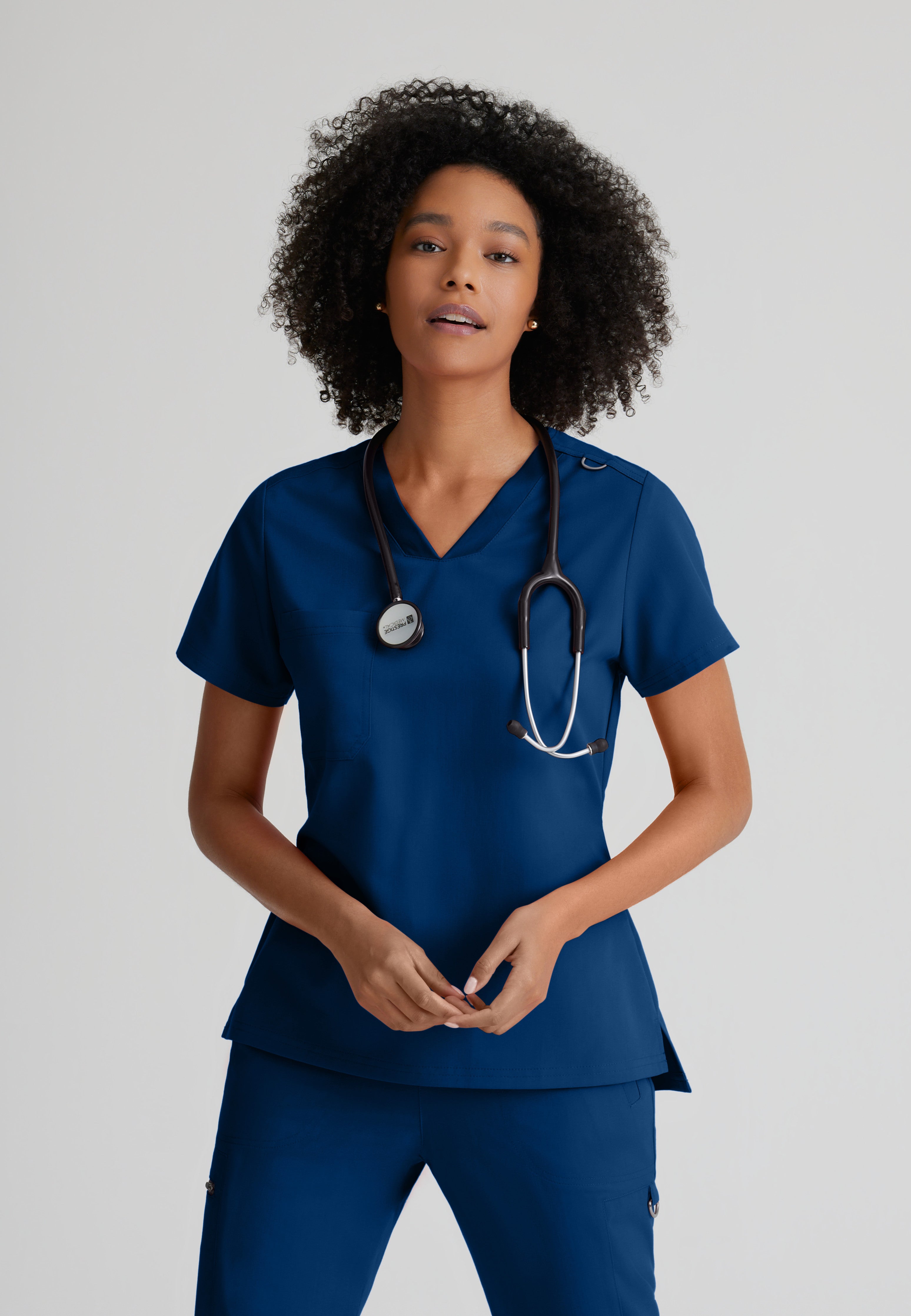 Front View of the Bree 1-Pocket Tuck-In Scrub Top in Indigo from Grey's Anatomy™ by Barco Spandex Stretch